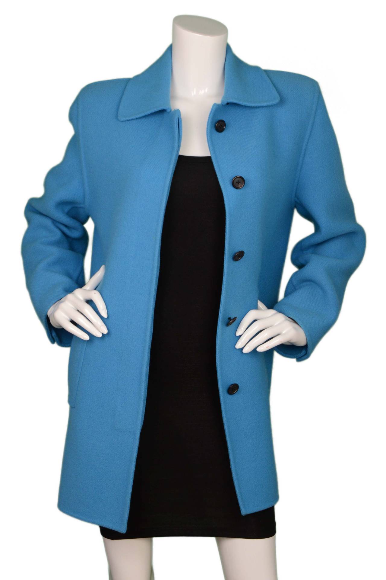 Marc Jacobs Blue Wool Swing Coat
Color: Blue
Composition: 100% Wool
Lining: None
Closure/Opening: Button down front
Exterior Pockets: Two hip slit pockets
Interior Pockets: None
Overall Condition: Excellent pre-owned condition with the