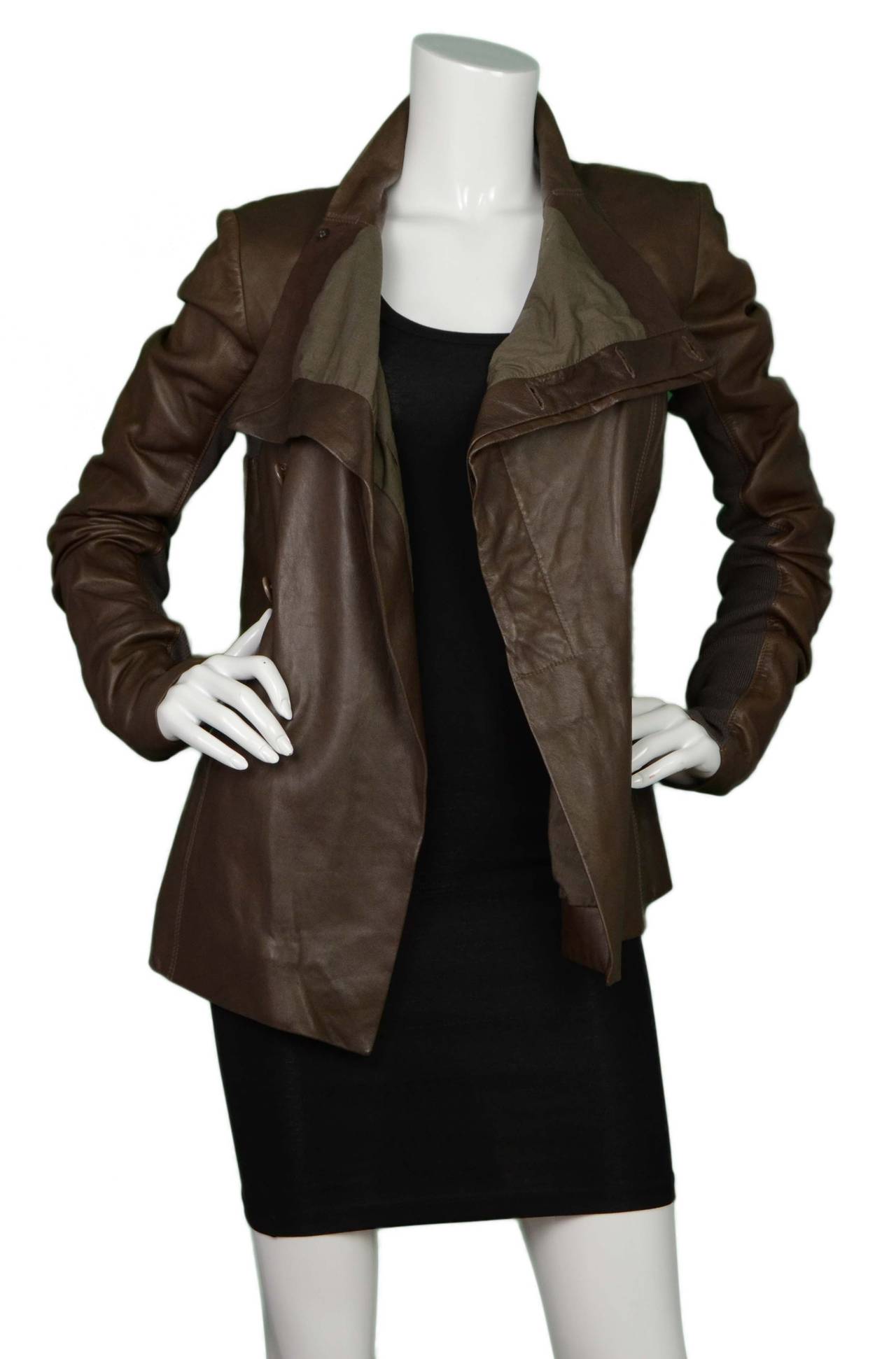 Rick Owens Brown Leather Asymmetrical Leather Jacket
Features ribbed cotton on under side of sleeves
Made In: Italy
Color: Brown
Composition: 100% Leather & 100% rayon
Lining: Brown, 100% cotton
Closure/Opening: Button up
Exterior Pockets: