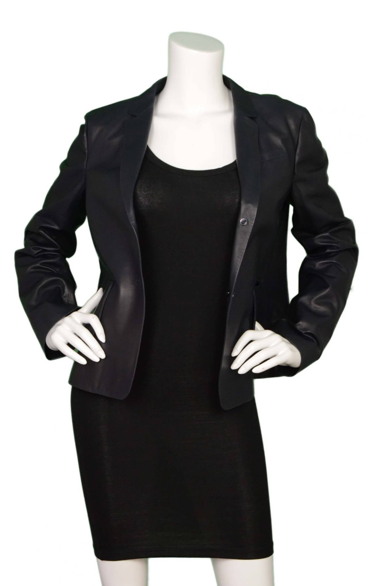 Jil Sander Black LeatherJacket
Made In: Italy
Color: Black
Composition: 100% leather
Lining: Black, 100% cotton
Closure/Opening: Double button down front
Exterior Pockets: Two hip patch pockets
Interior Pockets: None
Overall Condition: