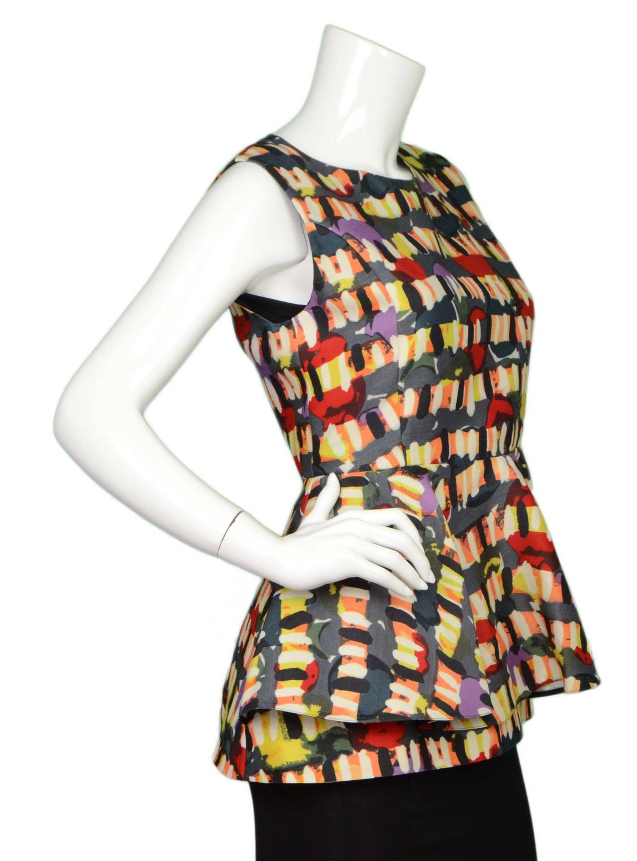Marni Multi-Colored Sleeveless Peplum Top 
Features brush stroke-style print throughout
Made In: Italy
Color: Multi-colored
Composition: 52% wool, 48% silk
Lining: Black, 52% viscose, 48% nylon-blend
Closure/Opening: Back center