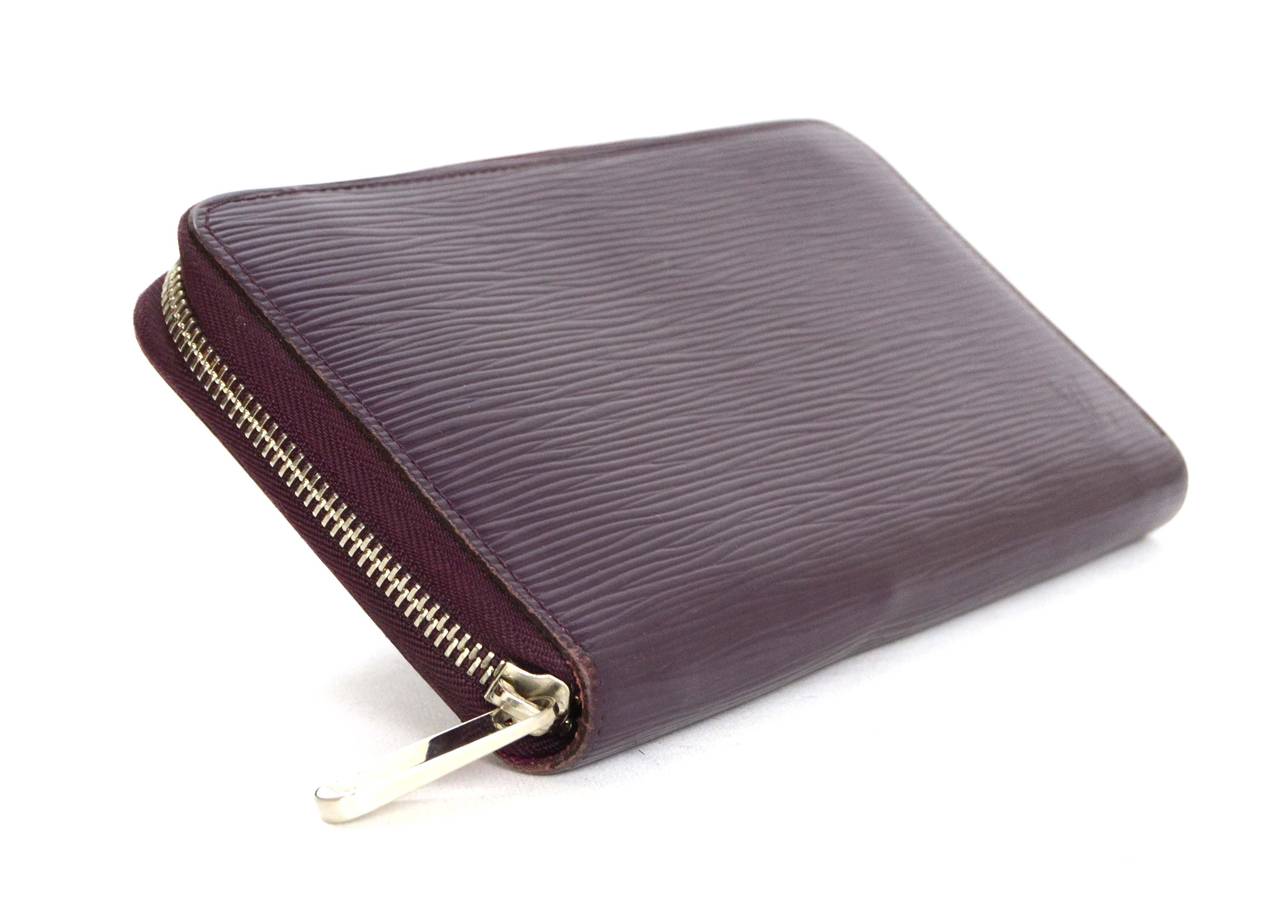 Louis Vuitton Eggplant Epi Leather Zippy Wallet
Made In: France
Year of Production: 2003
Color: Eggplant
Hardware: Silvertone
Materials: Epi leather and metal
Lining: Magenta coated canvas
Closure/Opening: Zip around closure
Exterior