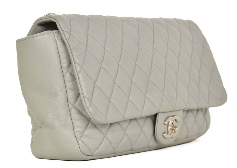 Chanel Grey Quilted Leather Paris-Shanghai Coco Rain Flap Bag

Age: c. 2009-2010

Made in Italy

Back zippered pocket house a nylon rain cover

Interior zippered pocket

CC twist lock

Hologram sticker reads :13630346

Stamped 