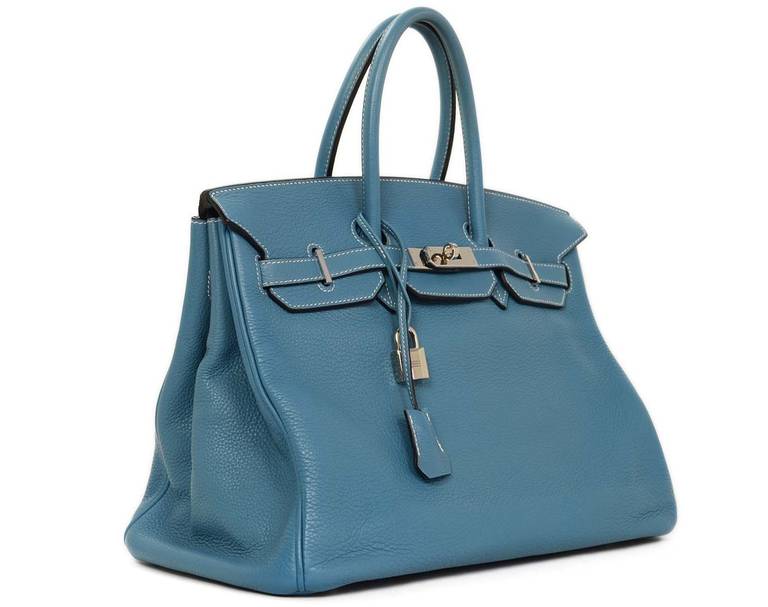 Hermes 35cm Togo Leather Blue Jean Birkin Bag
-Made in: France
-Year of Production: 2008
-Materials: Blue togo leather with white contrast stitching
-Hardware: Palladium
-Lining: Blue chevre leather
-Date Stamp: L inside of a square
-Interior
