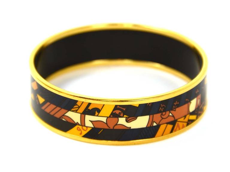HERMES Navy And Gold Zodiac Print Enamel Bangle
Made in: France
Year of Production: 2013
Materials: Metal, enamel
Stamps: 
