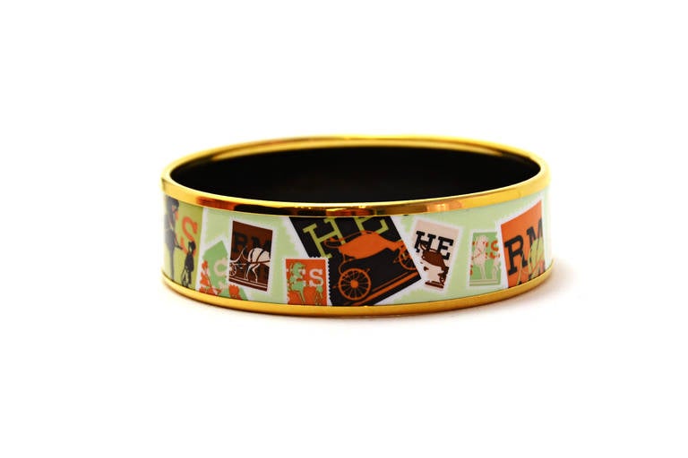 Features light green background with orange, black and beige carriage and horse stamps

-Made in: Austria
-Materials: Metal, enamel
 -Stamps: 