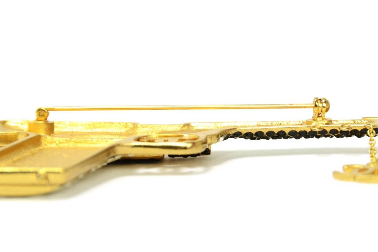 CHANEL 2001 Black & Clear Rhinestone Goldtone Gun Pin In Excellent Condition In New York, NY