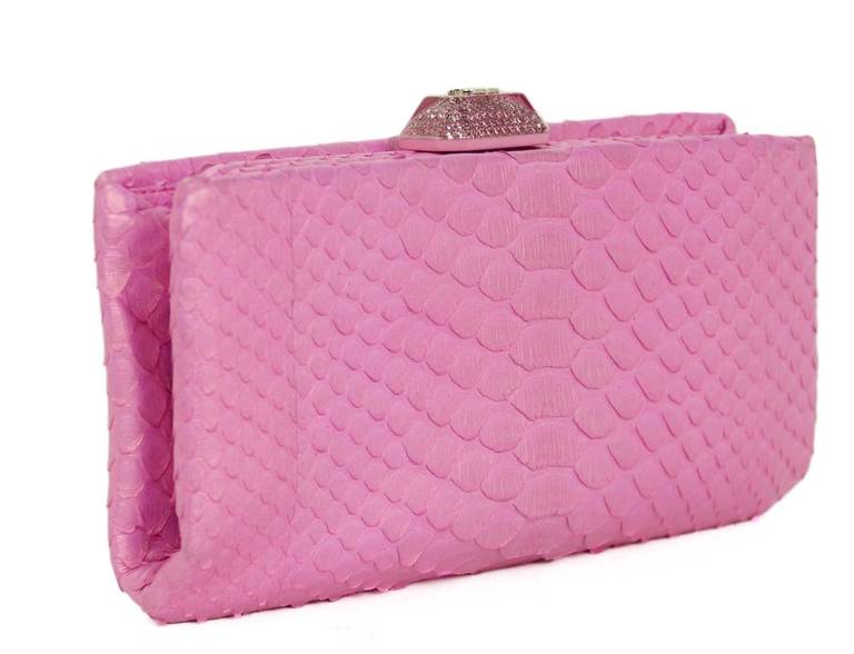Chanel Python evening clutch bag - retail $3,200

c.2013

Made in Italy

Pearlized pink python leather

Clutch bag with interior frame bag

Opens with pink resin and Strass crystal CC pushlock

Pink satin lining

Interior patch