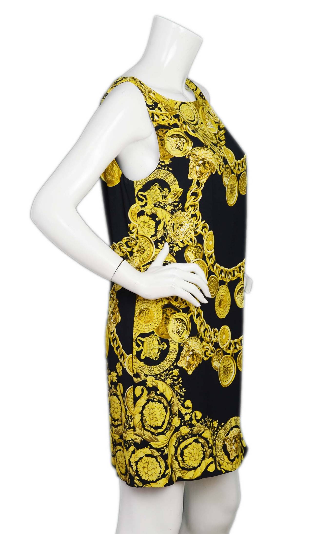 Black background with gold oversized medallion chain belt print
Features Medusa head and other vintage Versace icons
Flattering shift cut
Boatneck
Sleeveless
100% Viscose
Retails for $1,425 +tax