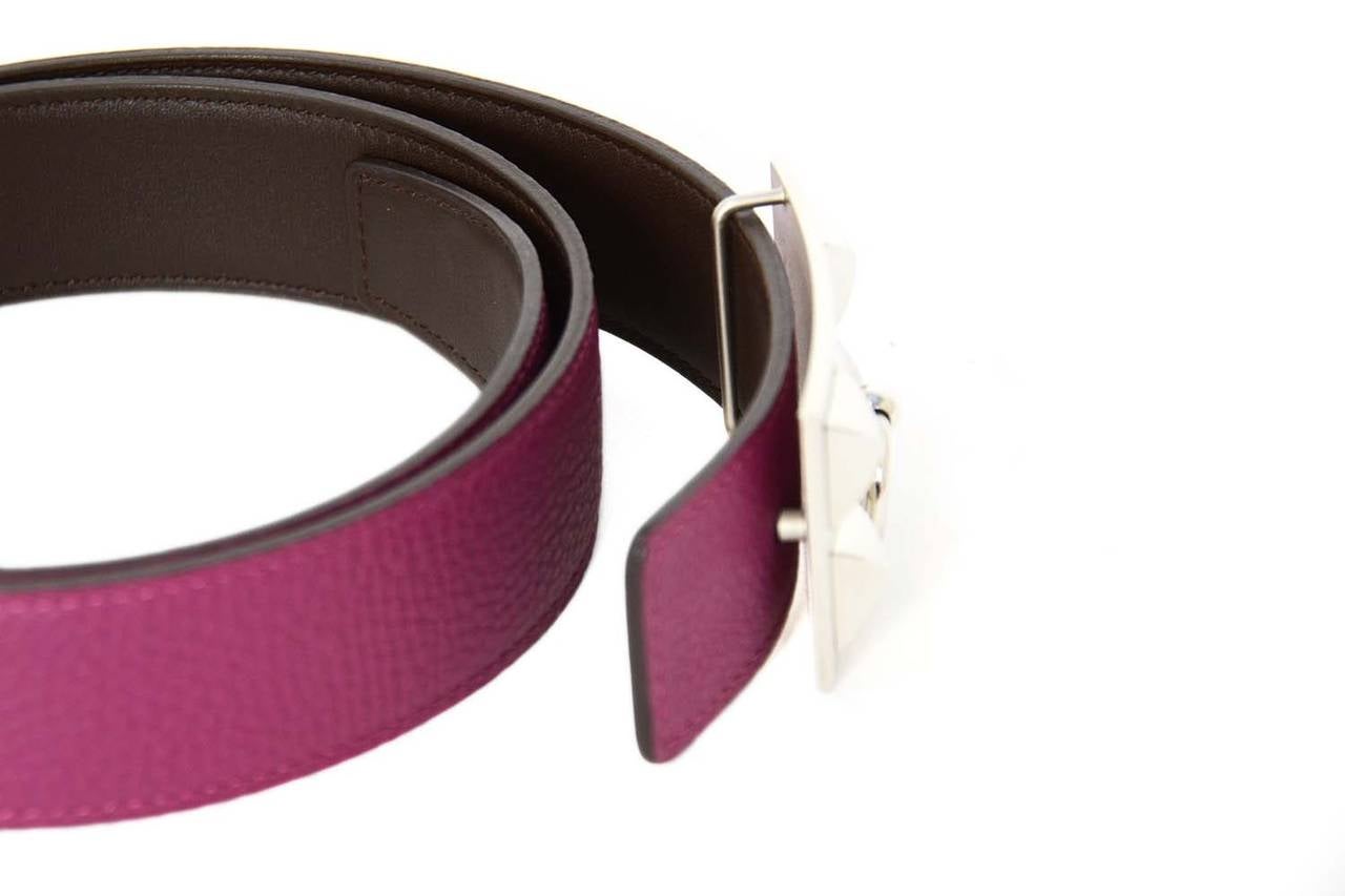 Features two different reversible belts in two different sizes with Hermes' classic medor stud buckle.

-Made in: France
-Year of Production: 2011
-Color: Tosca pink/brown and grey/black
-Materials: pink togo leather, grey epsom leather, and