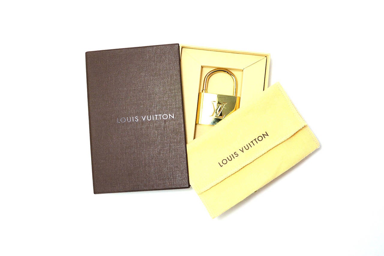 LOUIS VUITTON Goldtone Lock Bag Holder Hook at 1stDibs