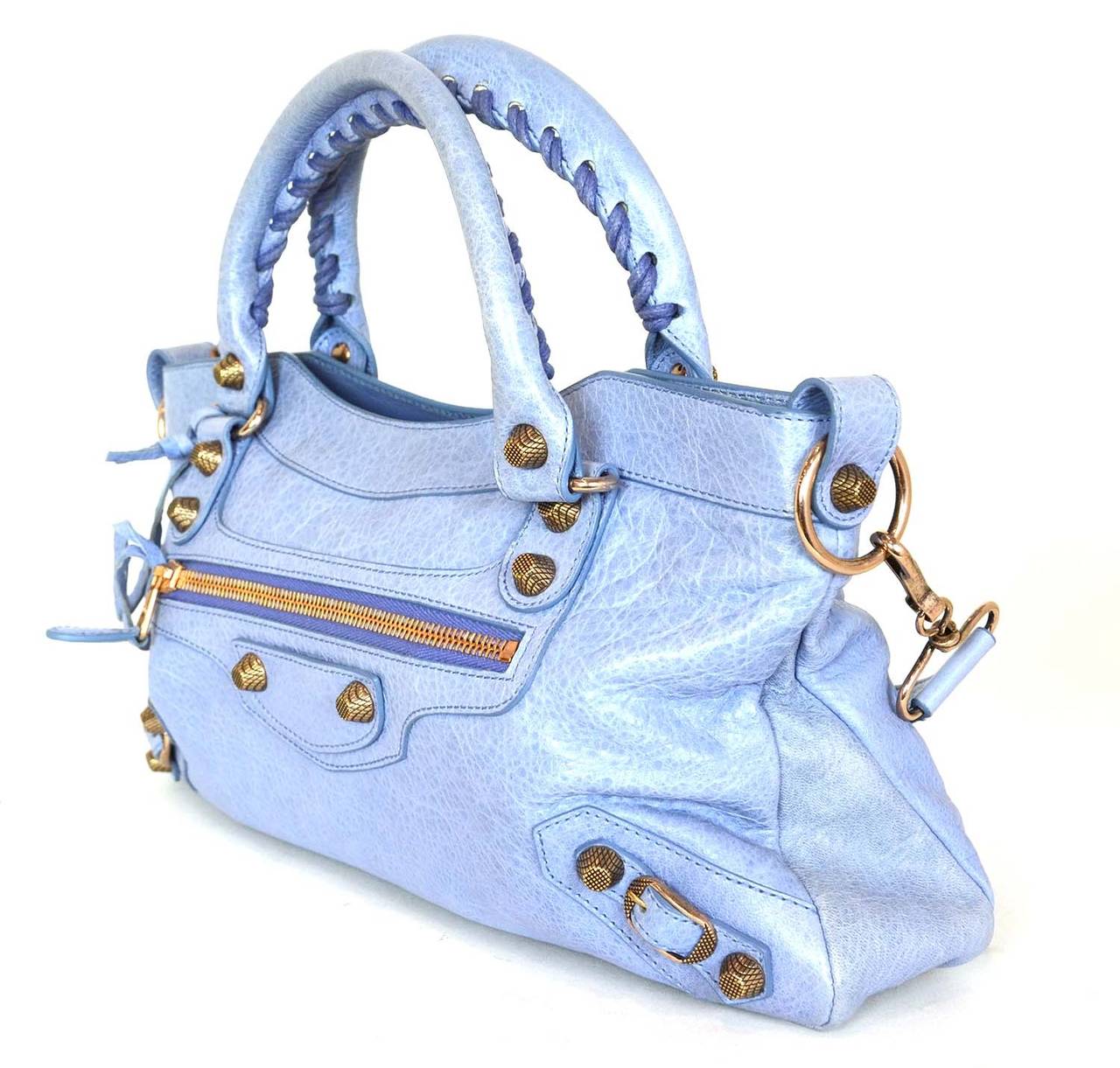 BALENCIAGA Periwinkle First Motorcycle Bag
This classic Balenciaga bag can be worn using only the top handles in the crook of the arm or with the removable strap at the shoulder.

    Made in: Italy
    Color: Periwinkle
    Materials: