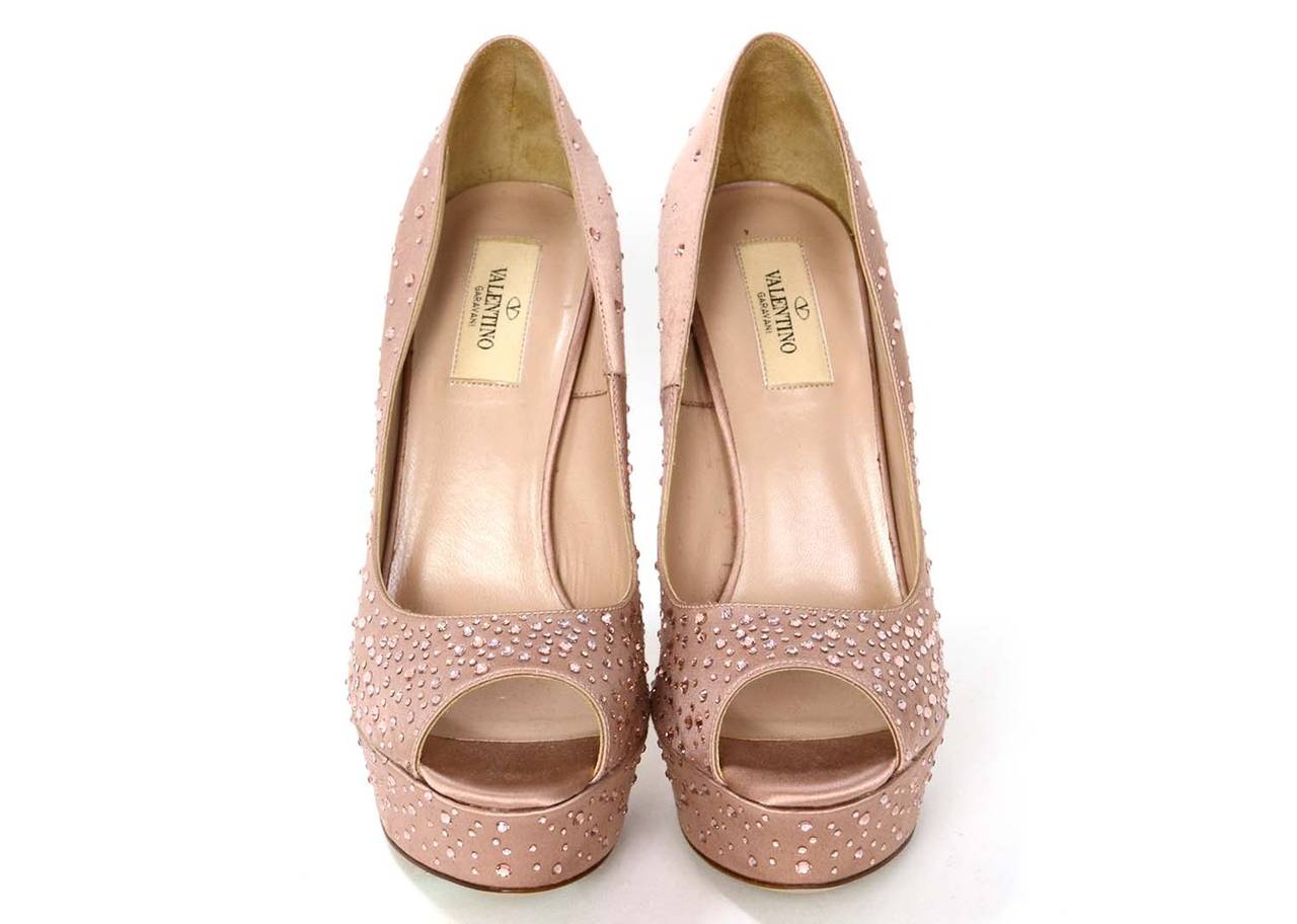 Valentino Champagne Satin Peep-Toe Platform Pumps w. Rhinestones

-Made in: Italy
-Color: Champagne pink
-Materials: Satin
-Lining: Leather
-Overall Condition: Excellent with minor fraying to satin around platform. Appears to have only been