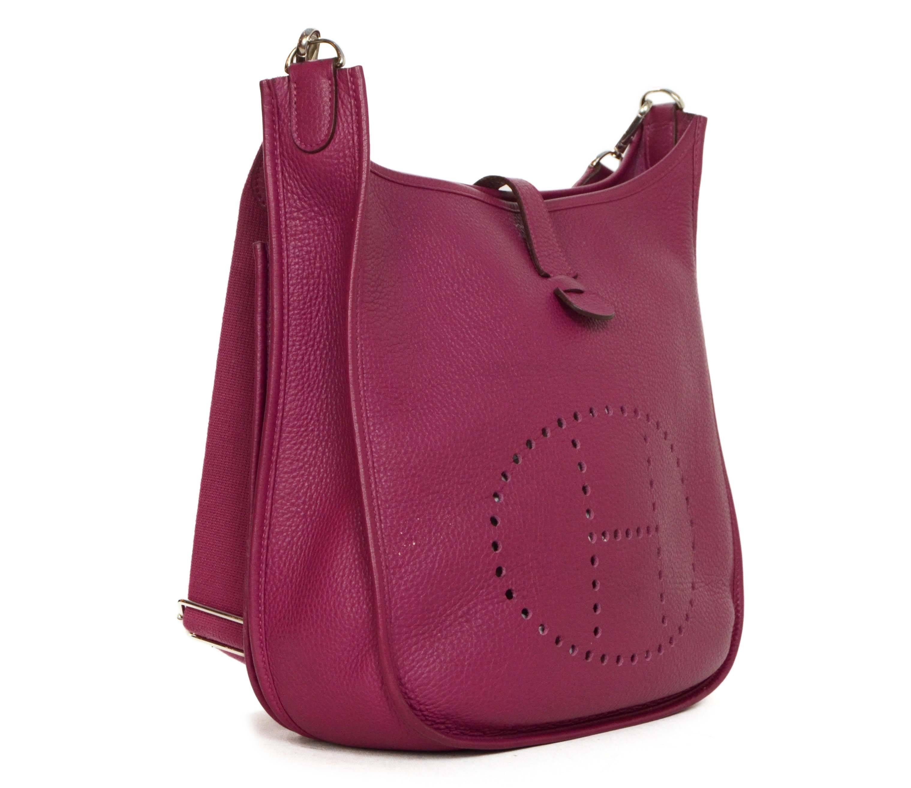 Hermes Magenta Leather Evelyne III GM Crossbody Bag 
Features adjustable shoulder strap
Made In: France
Year of Production: 2011
Color: Magenta
Hardware: Palladium
Materials: Leather
Lining: Magenta suede
Closure/Opening: Open top with