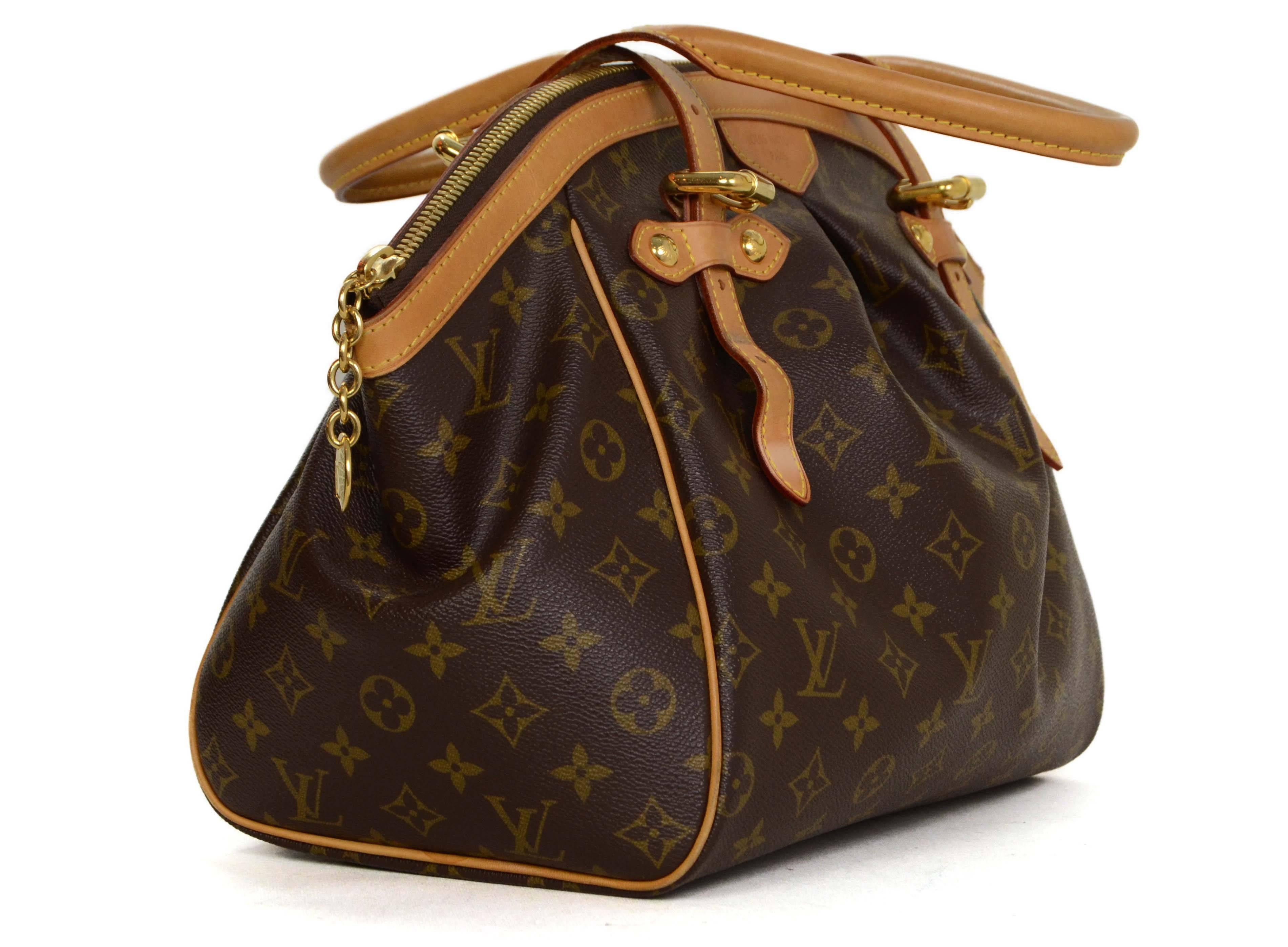Louis Vuitton Monogram Tivoli GM Tote 
Features adjustable handles
Made In: U.S.A
Year of Production: 2012
Color: Brown and tan
Hardware: Goldtone
Materials: Coated canvas, leather and metal
Lining: Brown canvas
Closure/Opening: Zip around