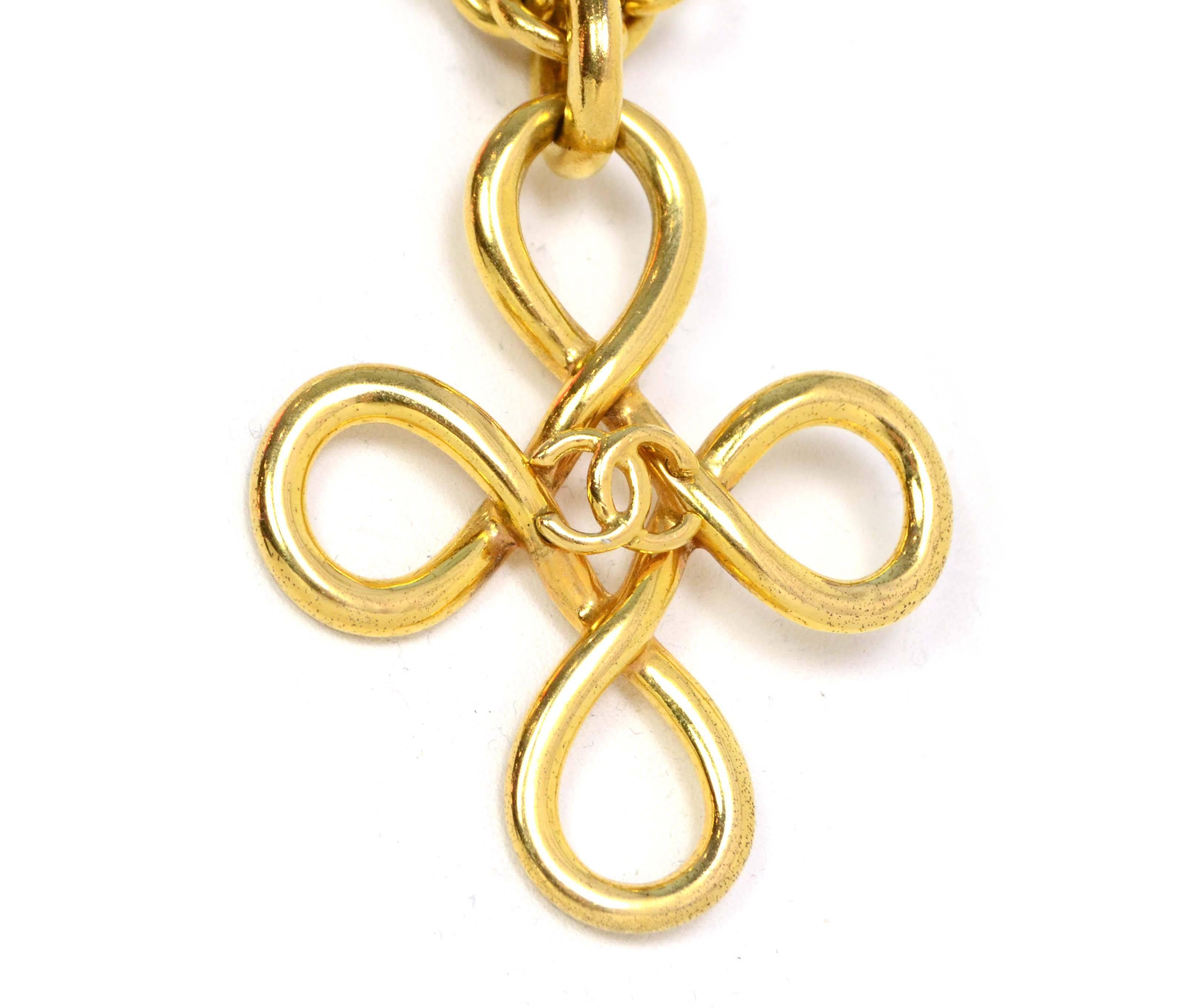 Chanel Vintage '93 Gold Swirl CC Cross Necklace 
Features small CC in center of swirl
Made In: France
Year of Production: 1993
Color: Goldtone
Materials: Metal
Closure: Jump ring closure
Stamp: 93 CC P
Overall Condition: Excellent vintage,