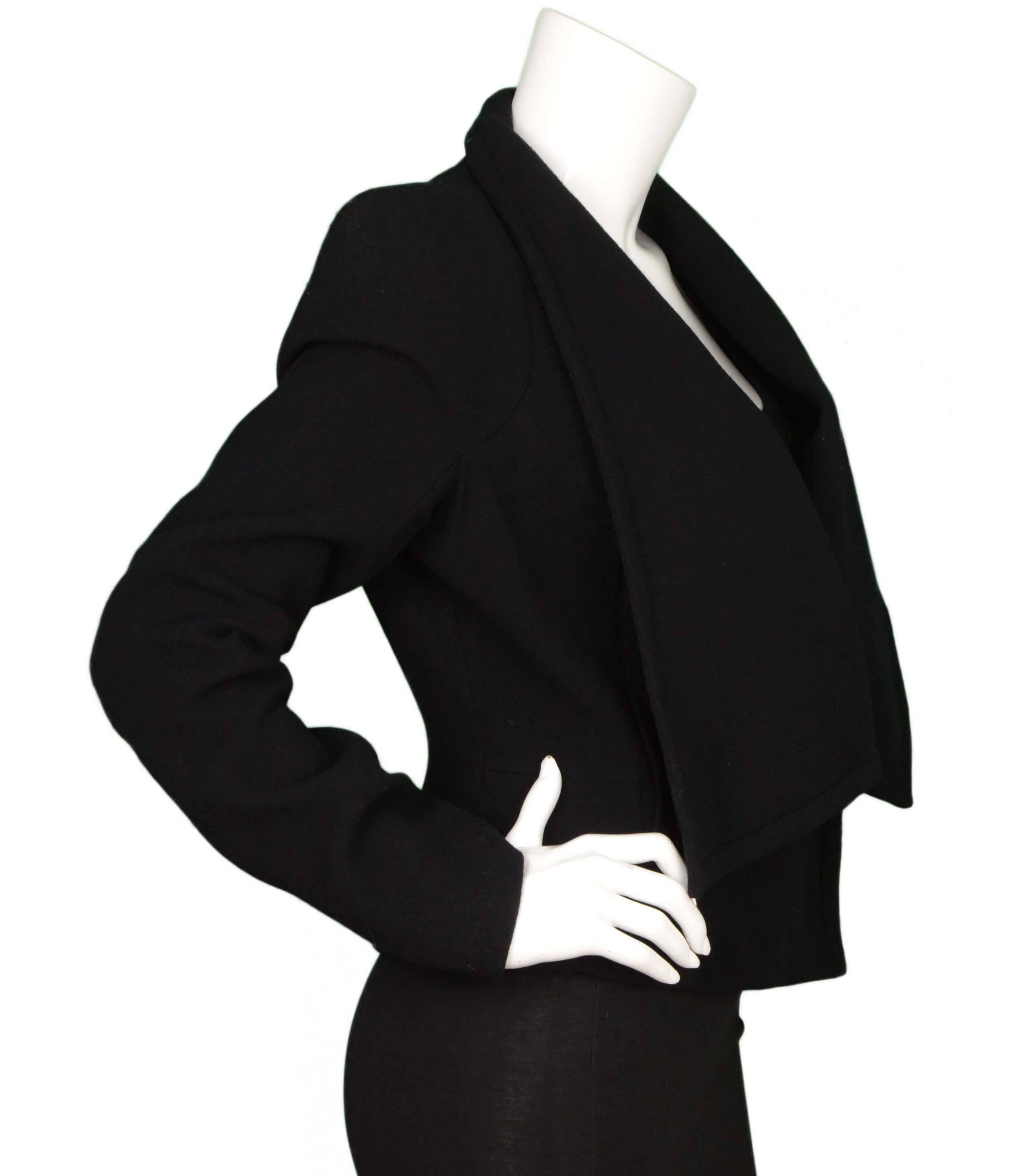 Givenchy Black Wool Cropped Coat 
Features structured padded shoulders and open waterfall front
Made In: Italy
Color: Black
Composition: 96% wool, 4% elastane
Lining: Black 100% Cupro
Closure/Opening: Open front with hook and eye closure at