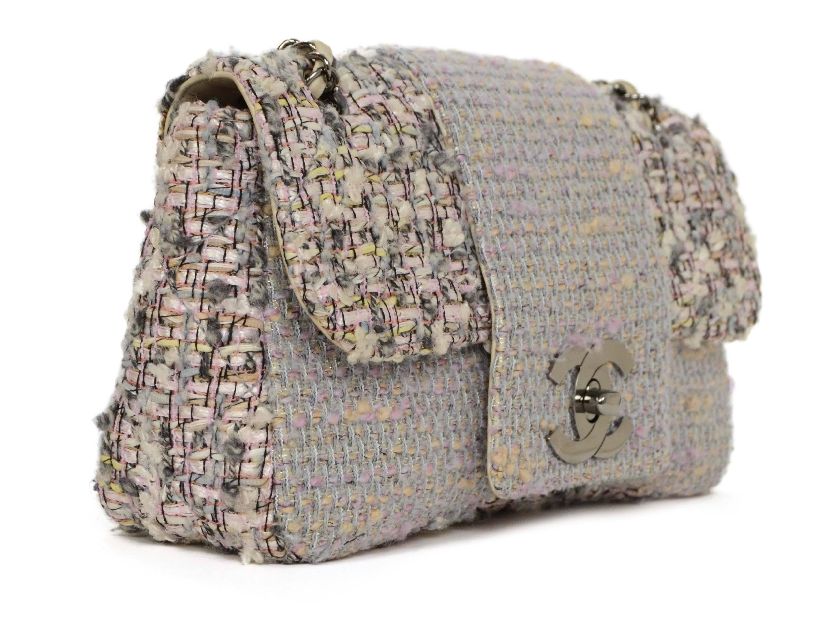 Chanel Pink & Grey Tweed Medium Classic Flap Bag 
Features metallic thread throughout creating a glitter effect to tweed
Made In: France
Year of Production: 2004-2005
Color: Pink, grey, ivory and black
Hardware: Ruthenium
Materials: Tweed,