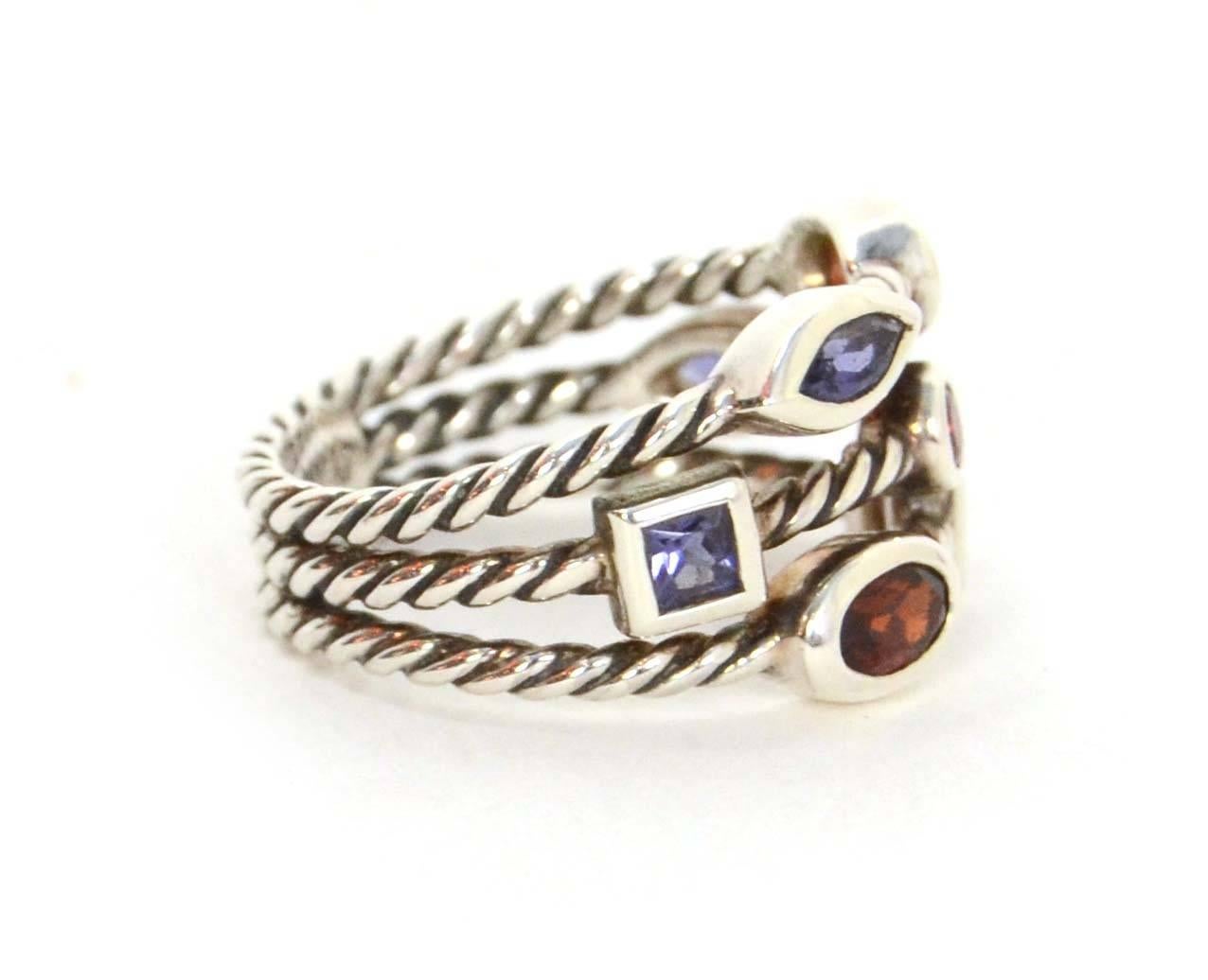 David Yurman Sterling & Multi-Colored Stone Confetti Ring 
Features different shapes and colored stones
Color: Purple, pink, red, and silver
Materials: Stone and sterling silver
Closure: None
Stamp: DY 925
Overall Condition: Excellent