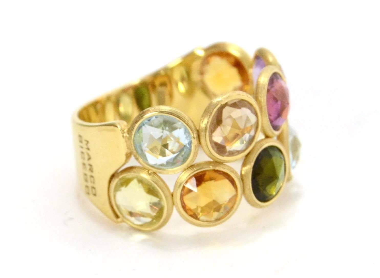 Marco Bicego 18k Gold & Multi-Colored Stone Jaipur Ring 
Features two rows of multi-colored gemstones

Made In: Italy
Color: Gold, green, blue, pink, purple, orange and peach
Materials: 18k gold and various stones
Closure: None
Stamp: 750