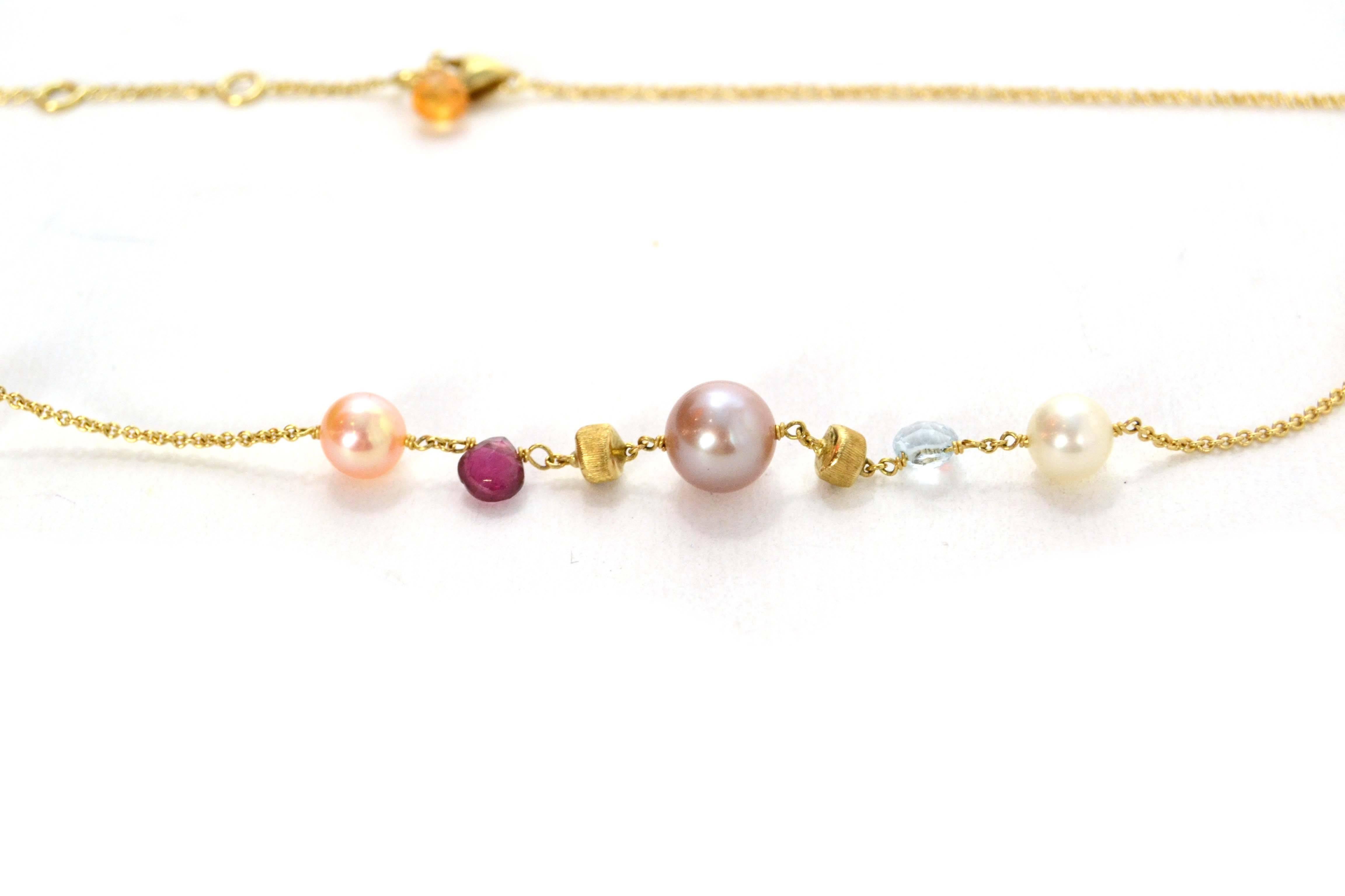 Marco Bicego Multi-Colored Stone & Pearl 18k Gold Necklace 
Features different shapes, sizes and colors of stones and pearls
Color: Gold, ivory, pink, purple, blue, orange and green
Materials: 18k gold, pearls and various stones
Closure: Lobster