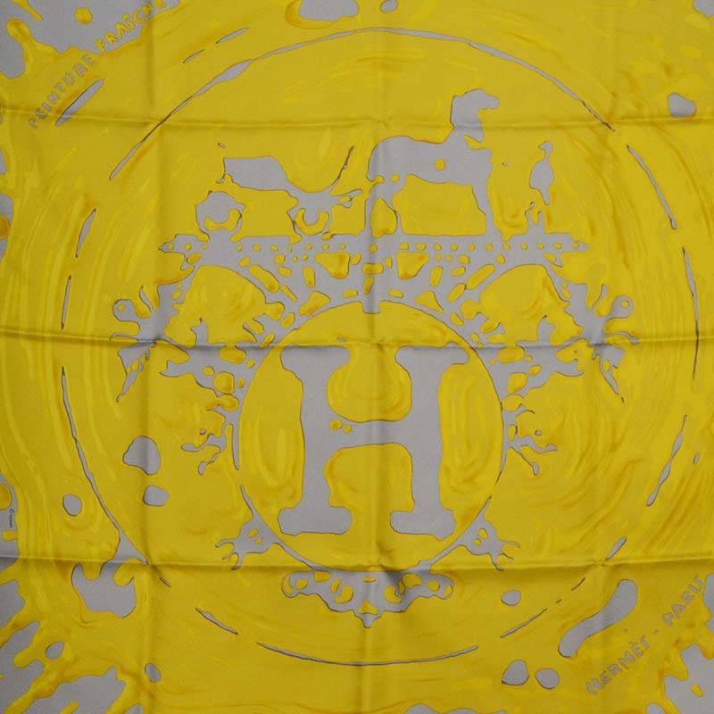 Hermes Yellow & Grey Paint Splatter 90cm Silk Scarf 
Features H written in paint splatter print on scarf
Made In: France
Color: Yellow and grey
Composition: 100% silk
Overall Condition: Excellent pre-owned condition
Includes: Hermes scarf