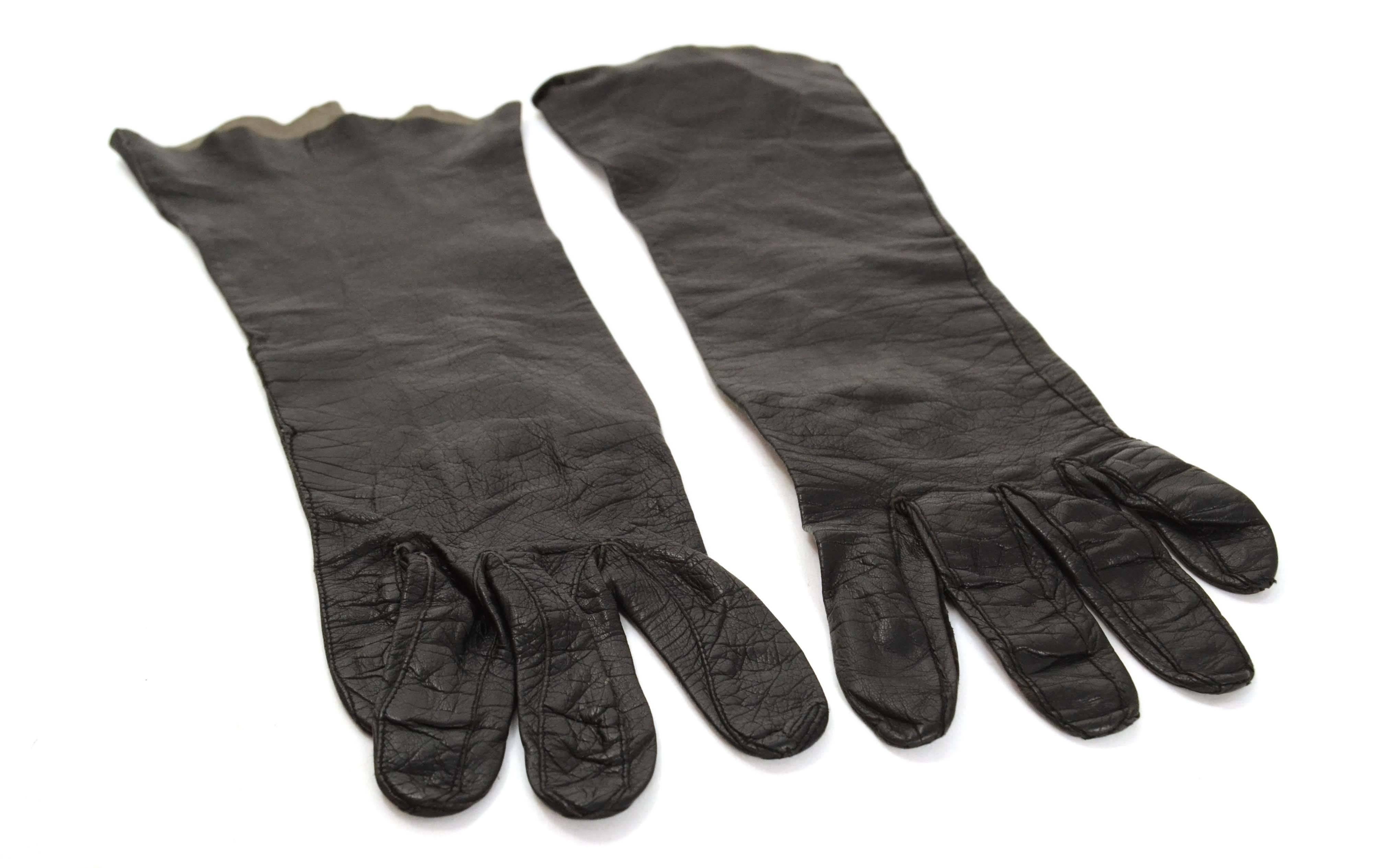 Vintage Black Leather Gloves 
Color: Black
Material: Leather
Closure/Opening: Pull on
Overall Condition: Excellent vintage, pre-owned condition with the exception of loose threads to end of seam on left glove
Size: Small
Total Length: 13.75