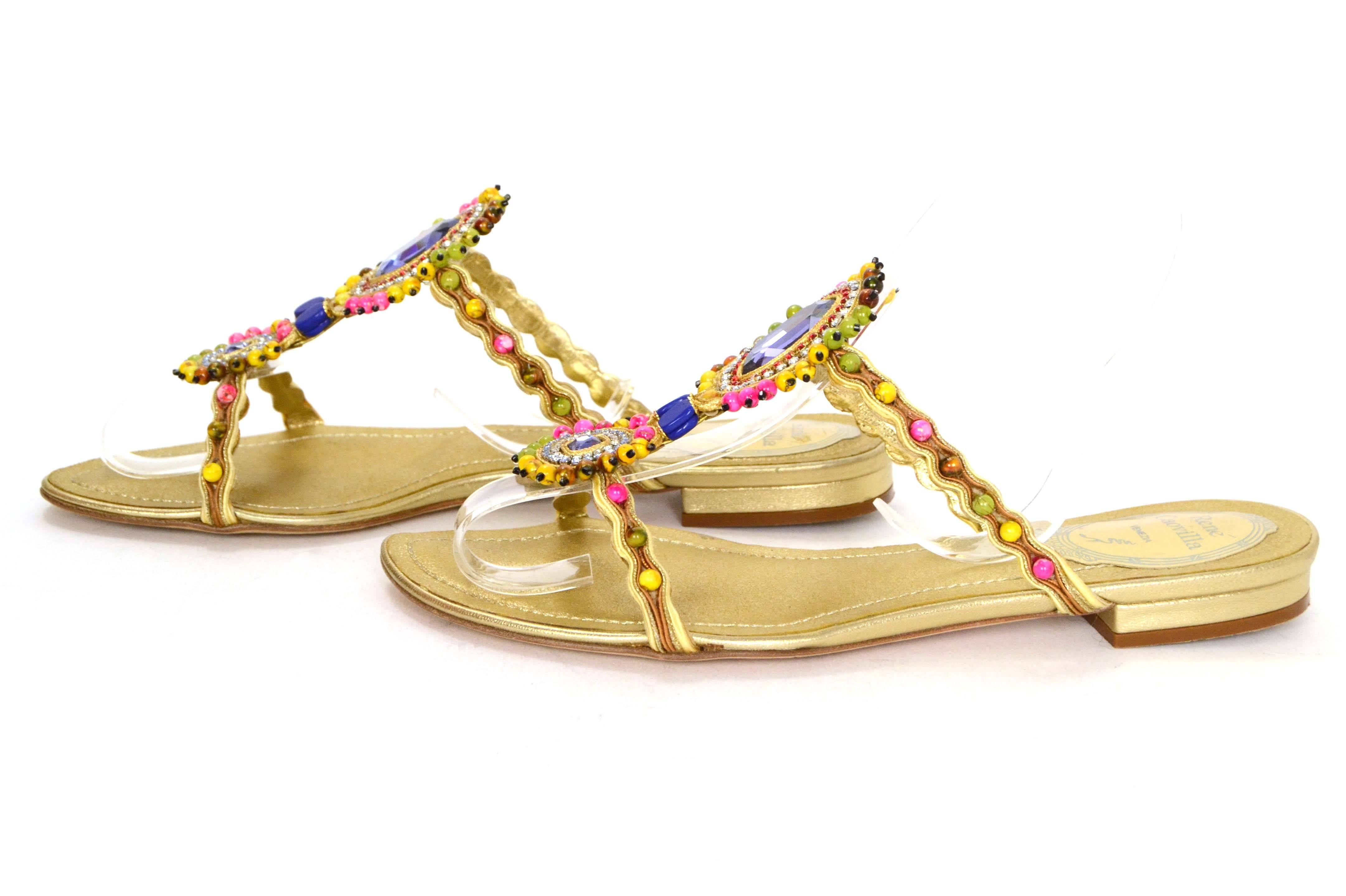 Rene Caovilla Gold Leather & Rhinestone Sandals 
Features brightly colored beads and rhinestones throughout

Made In: Italy
Color: Gold, pink, yellow, red, blue, green and brown
Materials: Leather, rhinestones and beads
Closure/Opening: