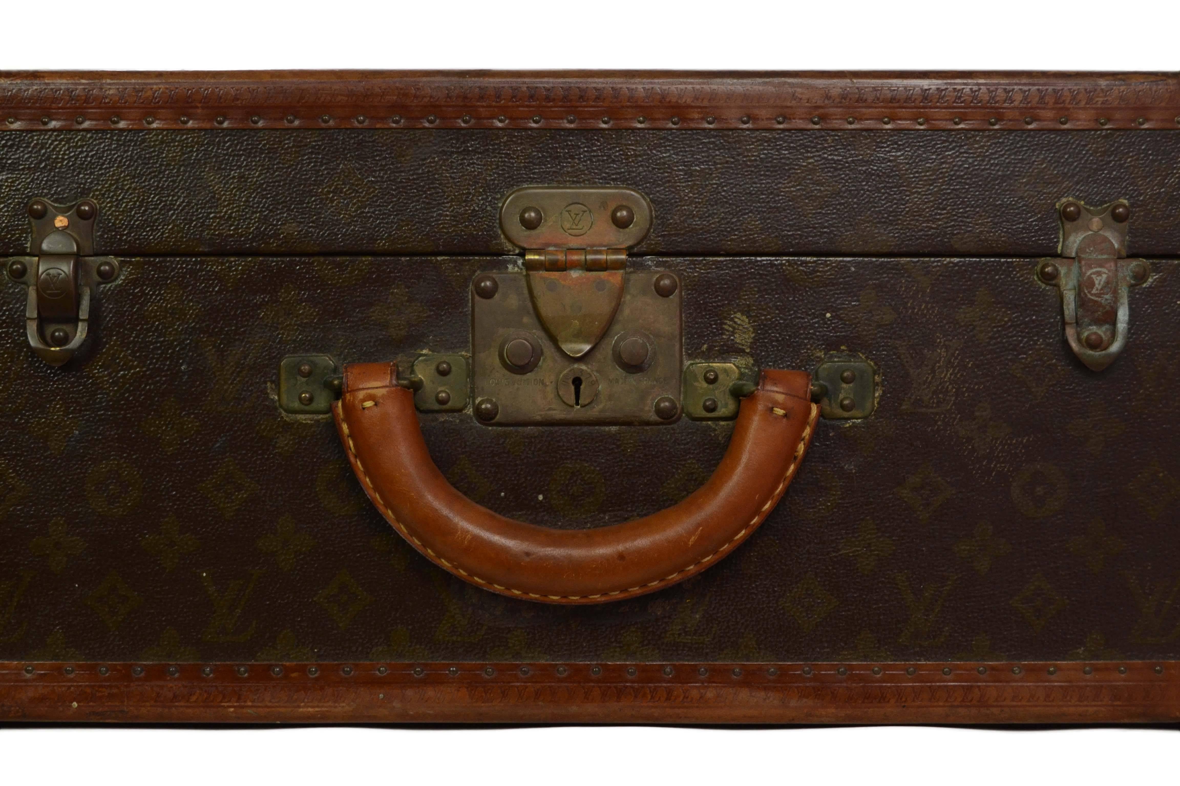 Louis Vuitton Vintage Monogram Square Trunk 
Made In: France
Color: Brown and bronze
Hardware: Brass
Materials: Coated canvas and leather
Lining: Beige linen
Closure/Opening: S lock closure with double sided trunk latches
Exterior Pockets: