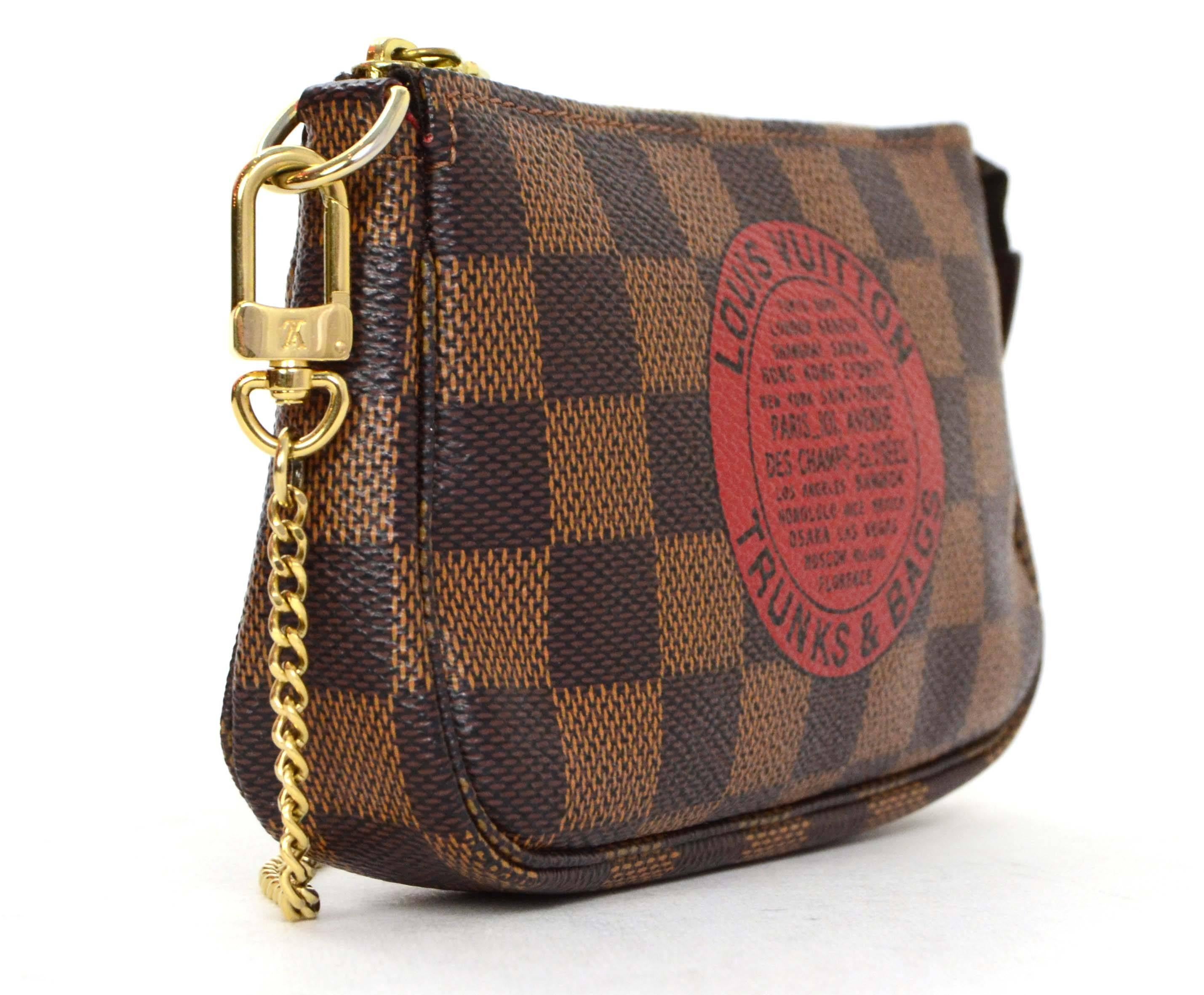 Louis Vuitton Collectors Damier Trunks & Bags Mini Pochette
Features detachable chain handle that can be clipped into a handbag

    Made In: France

    Year of Production: 2009

    Color: Damier Ebene

    Hardware: Goldtone

   