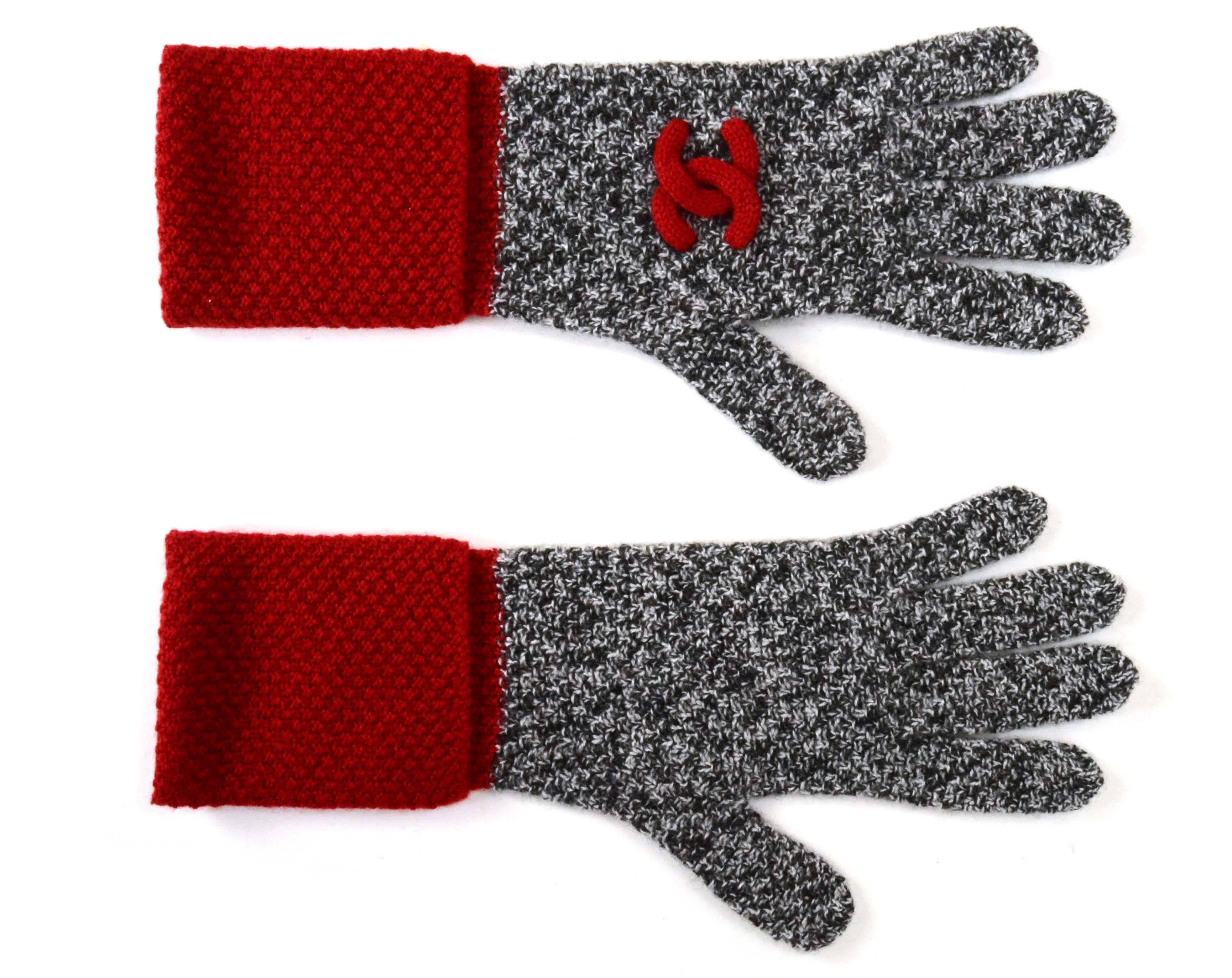 Features black and white knit with red trim.  Black and white CC on hat, red CC on gloves and black and white CC on scarf

-Made in: Great Britian
-Color:  Black and white wih red trim
-Composition: 100% casmere
-Overall Condition: Excellent