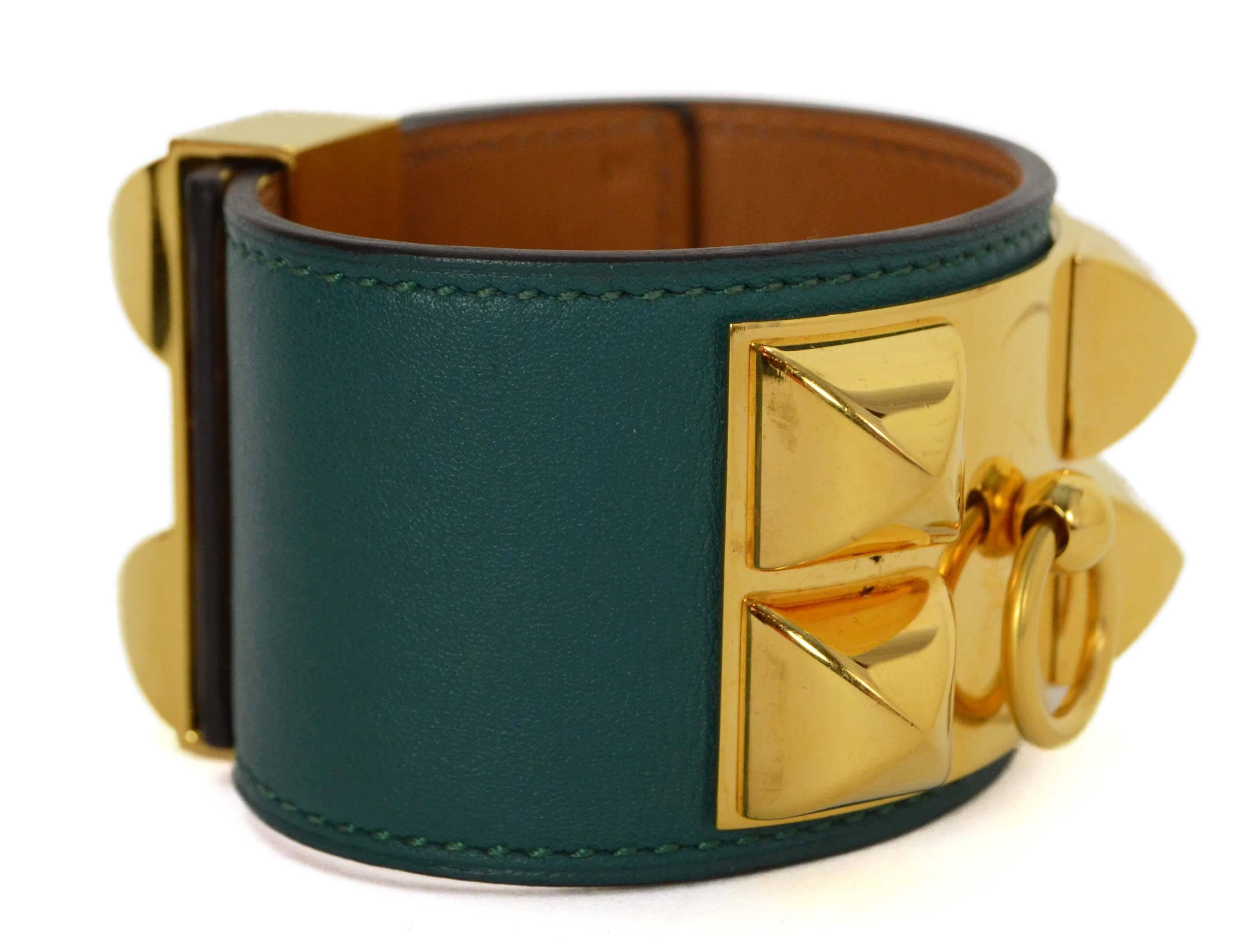 Hermes Malachite Swift CDC Cuff 
Made In: France
Year of Production: 2013
Color: Malachite green
Hardware: Goldtone
Materials: Swift leather and metal
Closure: Stud and notch closure
Stamp: Q stamp in square
Overall Condition: Excellent