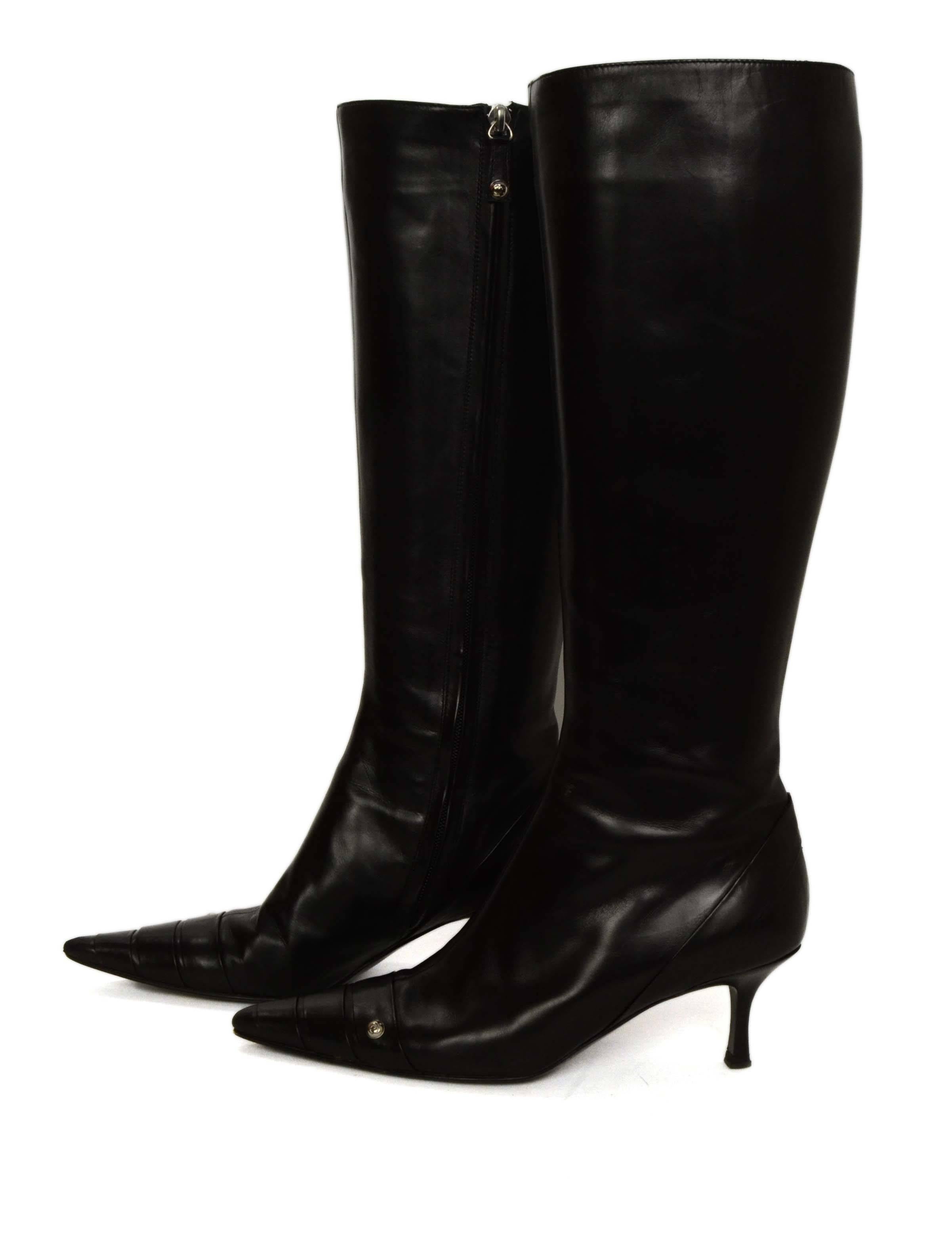 Chanel Black Leather Kitten Heel Knee-High Boots 
Made In: Italy
Color: Black
Materials: Leather
Closure: Side zipper
Sole Stamp: CC Made in Italy 38
Overall Condition: Excellent pre-owned condition with the exception of wearing throughout
