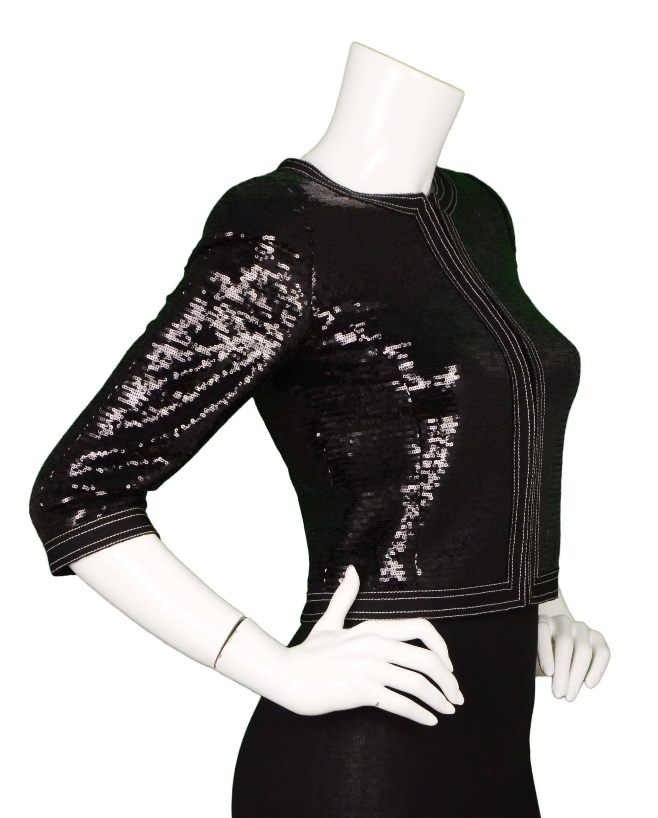 Chanel Black Sequin Cropped Evening Jacket 
Features black grosgrain trim
Made In: France
Color: Black
Composition: 100% polyester
Lining: Black, 100% silk
Closure/Opening: Zip front closure
Exterior Pockets: None
Interior Pockets: