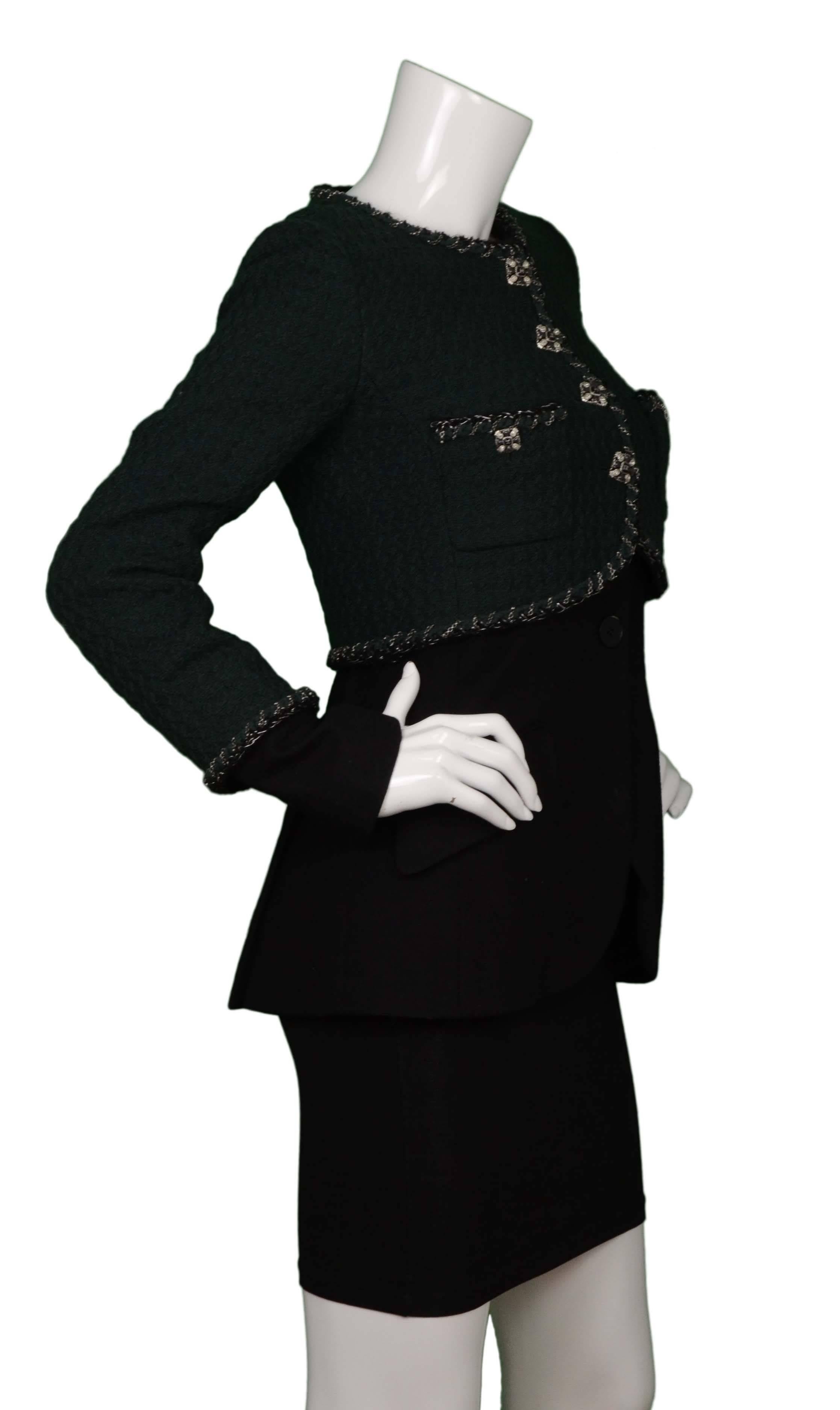 Chanel Green & Black Boucle Jacket 
Features double set of buttons for under jacket attachment. Top jacket features chain detailing throughout trim
Color: Green and black
Composition: Top jacket- 100% wool, Bottom jacket- 98% wool, 2%