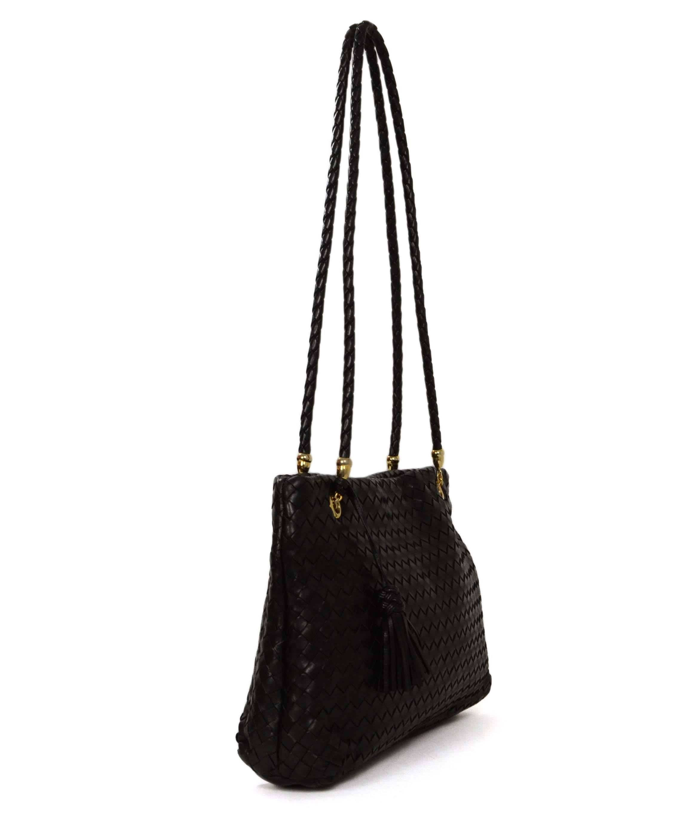 Bottega Veneta Black Woven Leather Bag 
Features large black tassel on shoulder strap
Made In: Italy
Color: Black
Hardware: Goldtone
Materials: Leather 
Lining: Beige leather
Closure/Opening: Open top with magnetic snap closure
Exterior