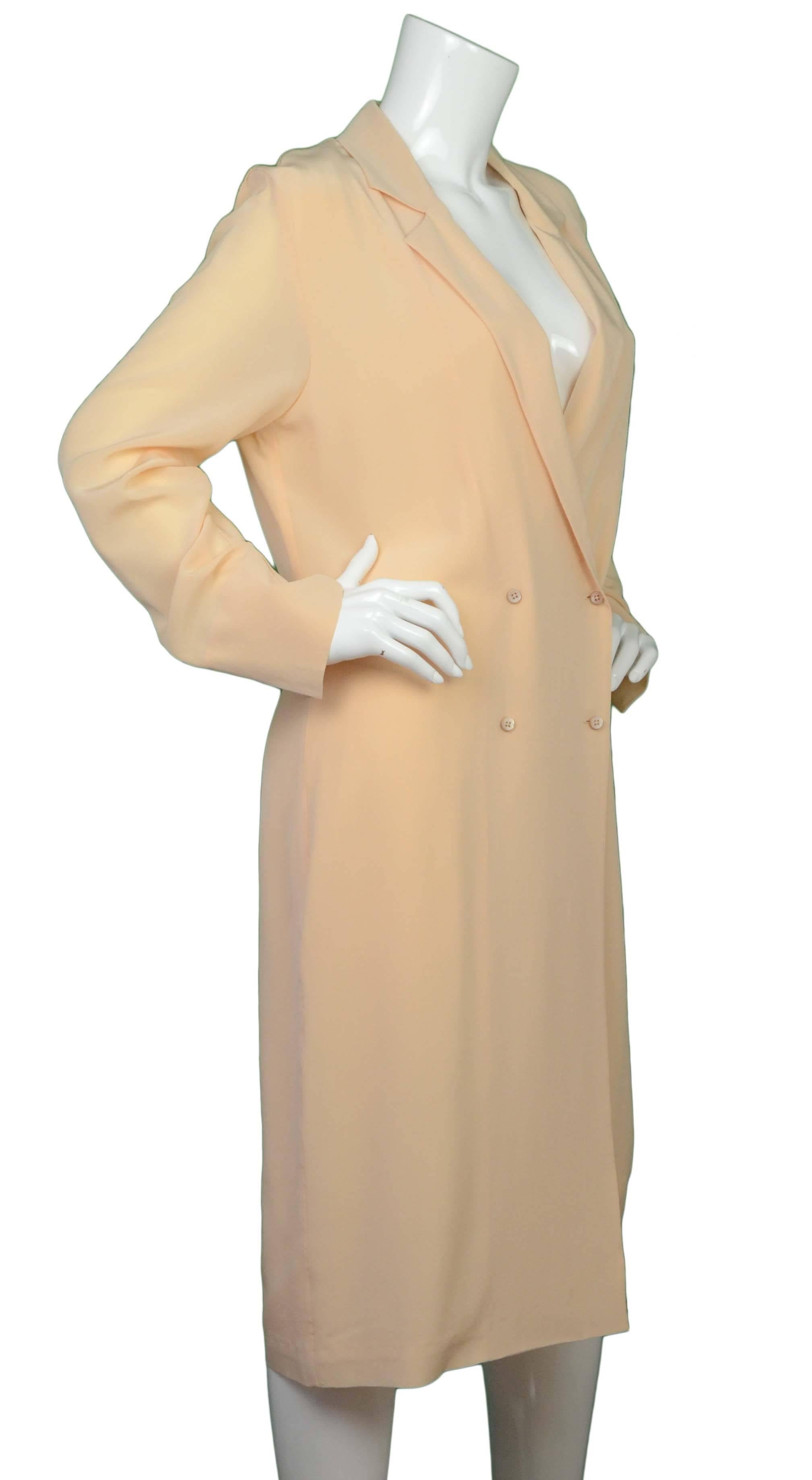 Maison Martin Margiela Peach Crepe de Chine Dress/Coat 
Made In: Italy
Color: Peach
Composition: 100% silk
Lining: Peach, 54% acetate, 28% polyamide, 20% silk
Closure/Opening: Double breasted button down front
Exterior Pockets: None
Interior