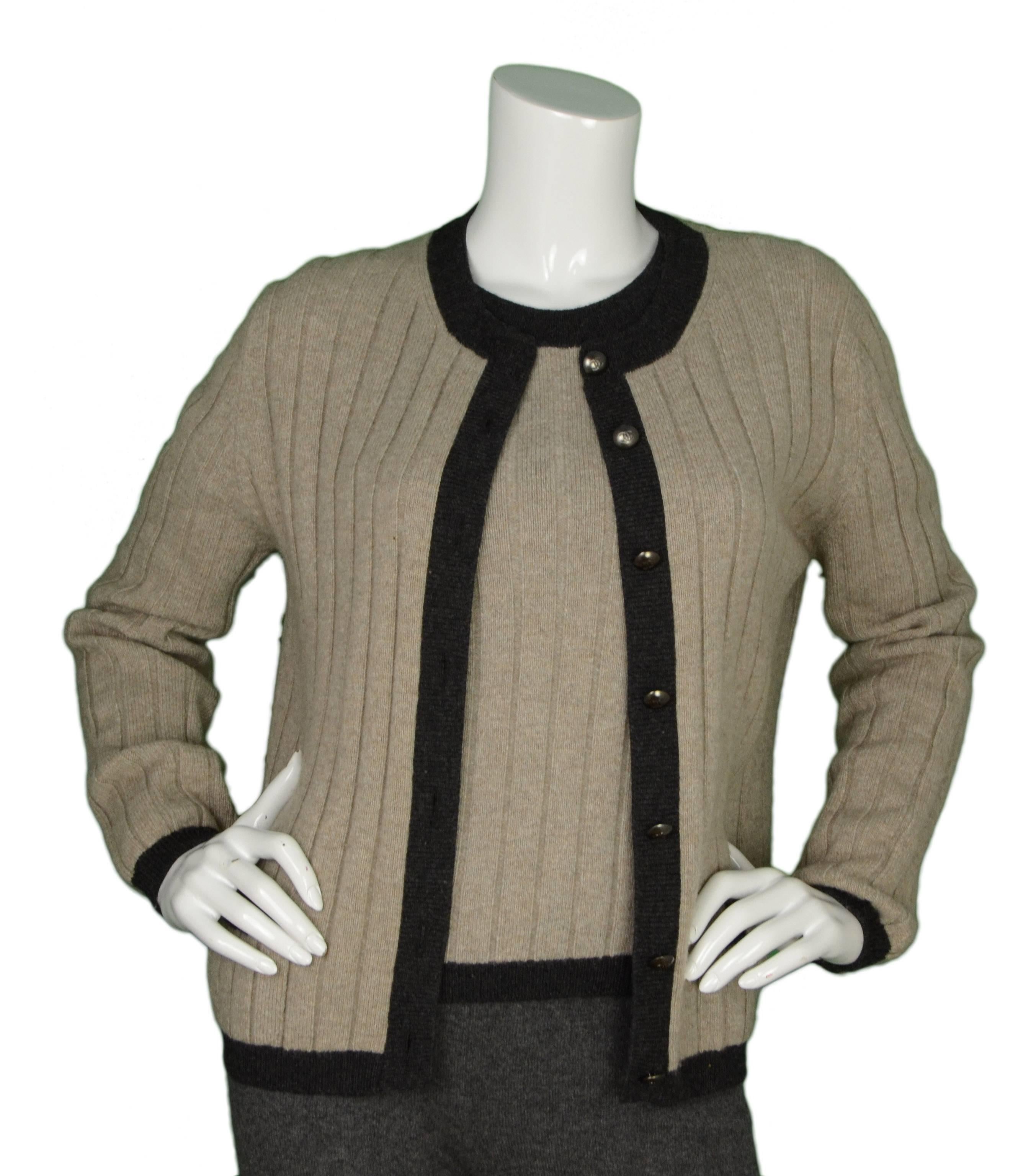 Chanel Vintage '97 Beige Cashmere Sweater Set 
Made In: France
Year of Production: 1997
Color: Beige and grey
Composition: 100% cashmere
Lining: None
Closure/Opening: Top- pull over, Cardigan- front button down closure
Exterior Pockets: Top-