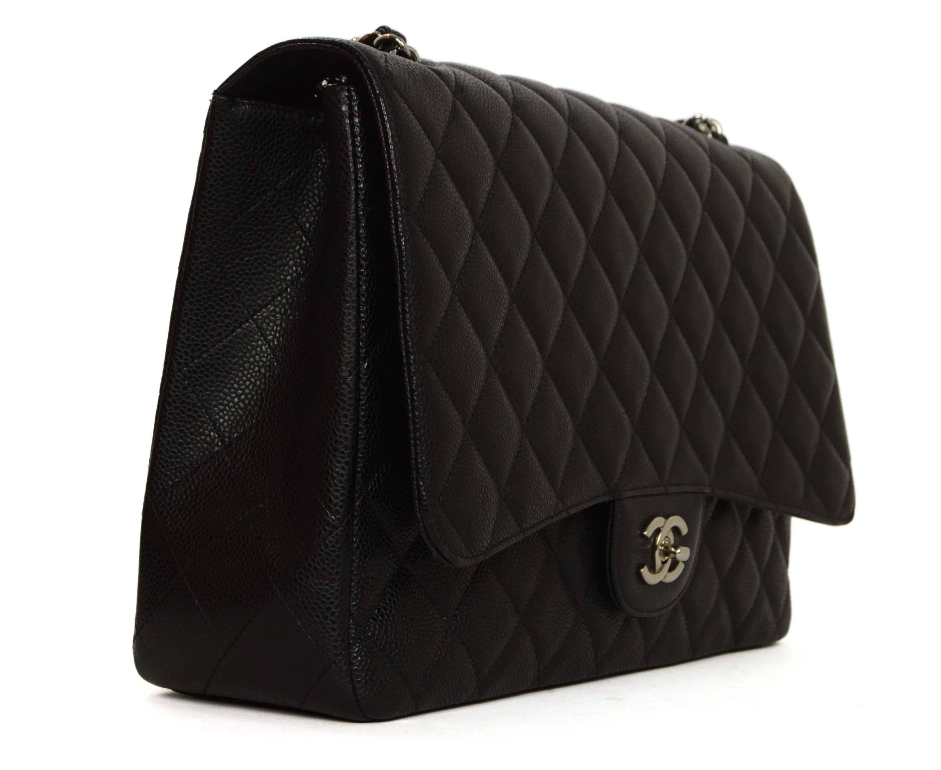 Chanel Black Quilted Caviar Maxi Classic Flap Bag 
Features adjustable shoulder strap
Made In: Italy
Year of Production: 2009-2010
Color: Black and silver
Hardware: Silvertone
Materials: Caviar leather
Lining: Black leather
Closure/Opening: