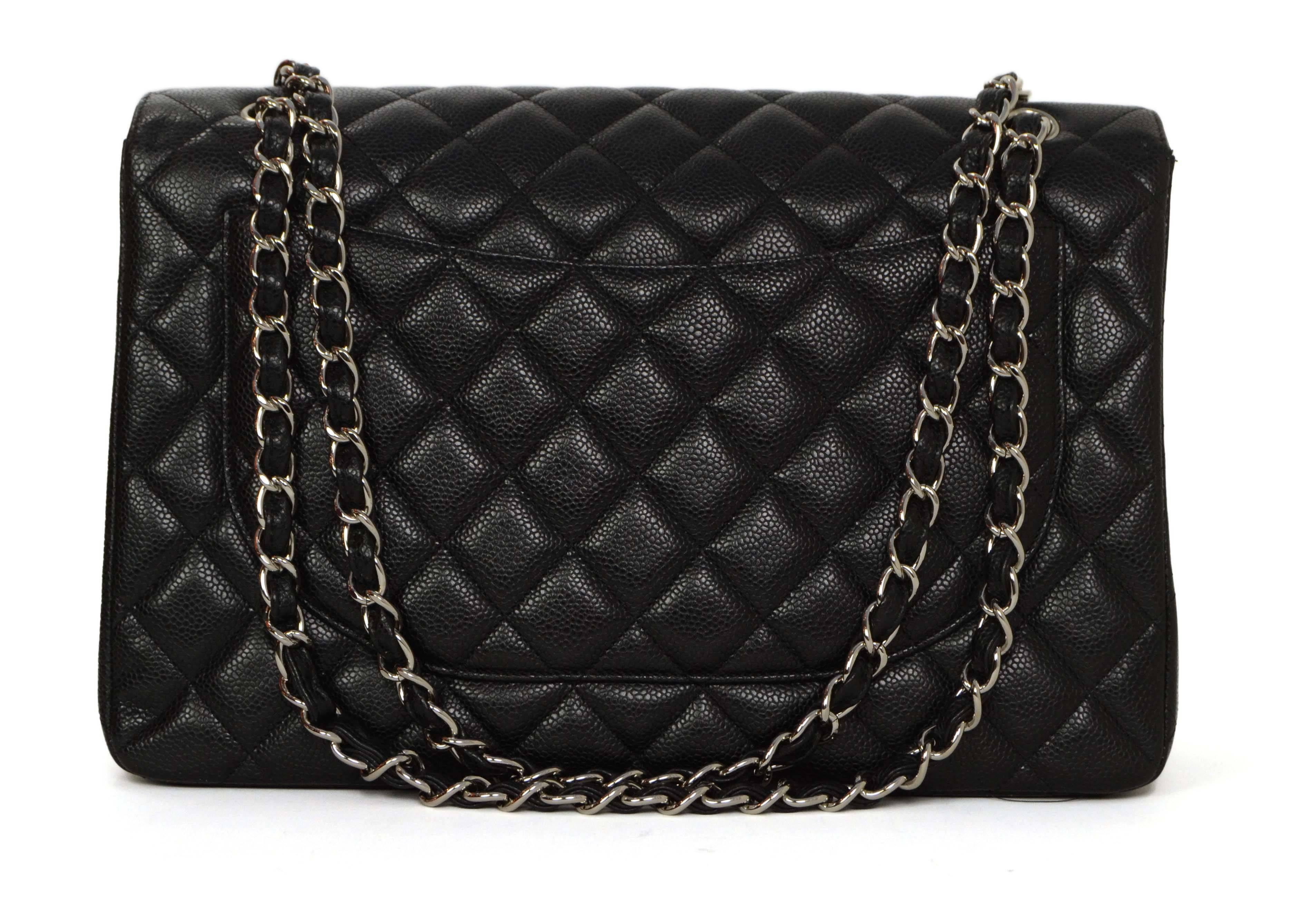 Chanel Black Quilted Caviar Maxi Classic Flap Bag SHW In Excellent Condition In New York, NY