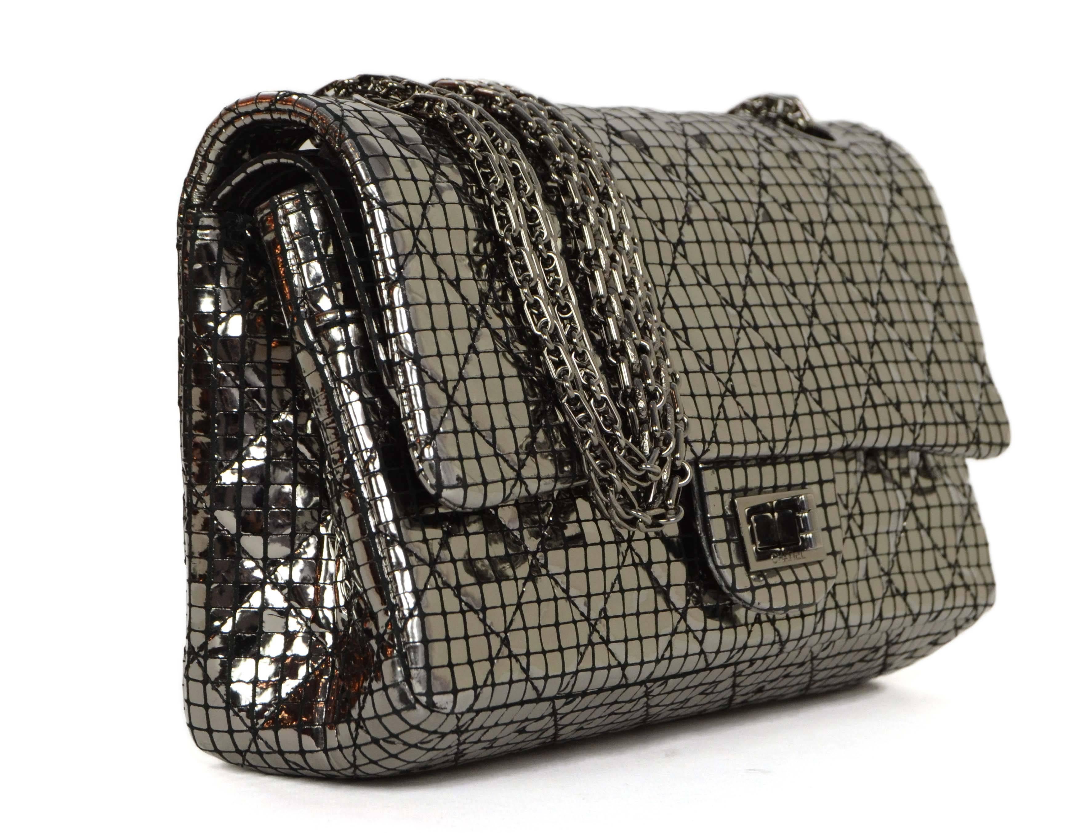 Chanel Silver Mirror 2.55 Re-Issue Double Flap Bag
Made In: France
Year of Production: 2012
Color: Silver mirror
Hardware: Ruthenium
Materials: Textile and metal
Lining: Black leather
Closure/Opening: Double flap top with snap and twist lock
