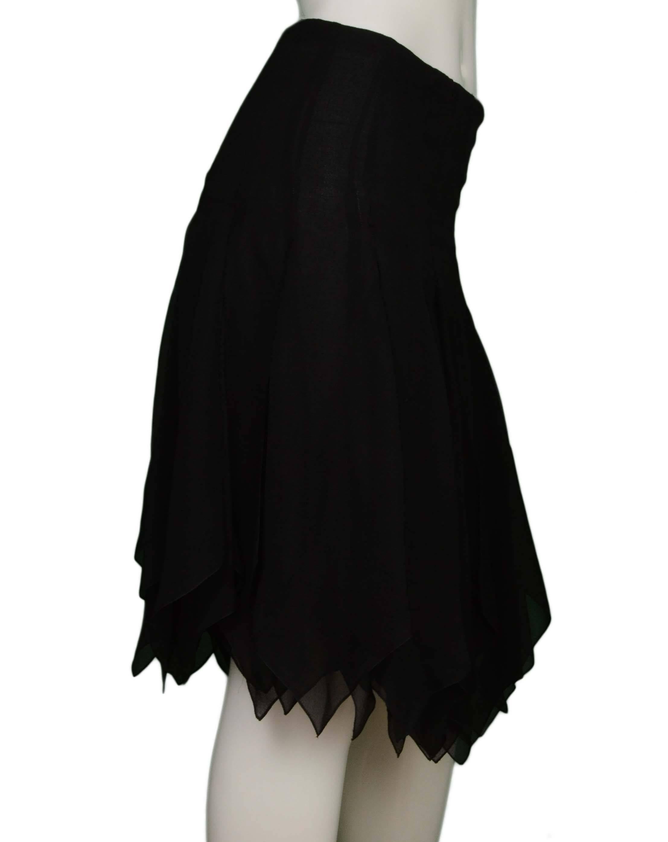 Chanel Black Silk Pleated Carwash Skirt 
Features asymmetrical hemline
Made In: France
Year of Production: 2006
Color: Black
Composition: 100% silk
Lining: Black, 100% silk
Closure/Opening: Back center zipper closure
Exterior Pockets: