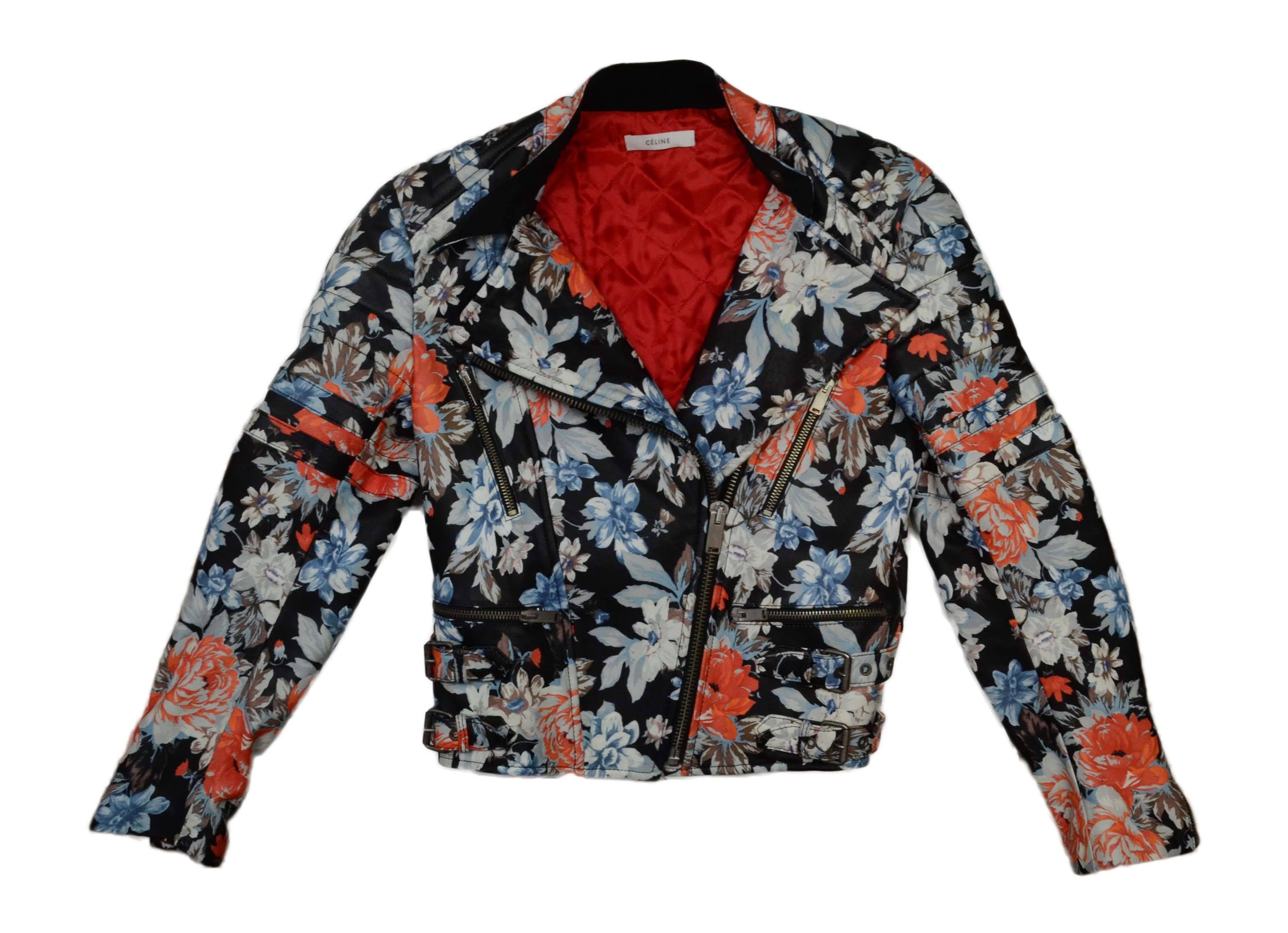 Celine Floral Print Leather Moto Jacket 
Features stitched detailing at shoulders and arms
Made In: Italy
Color: Black and Multi-colored
Composition: 100% lambskin
Lining: Red, 100% viscose
Closure/Opening: Front zip up
Exterior Pockets: Two