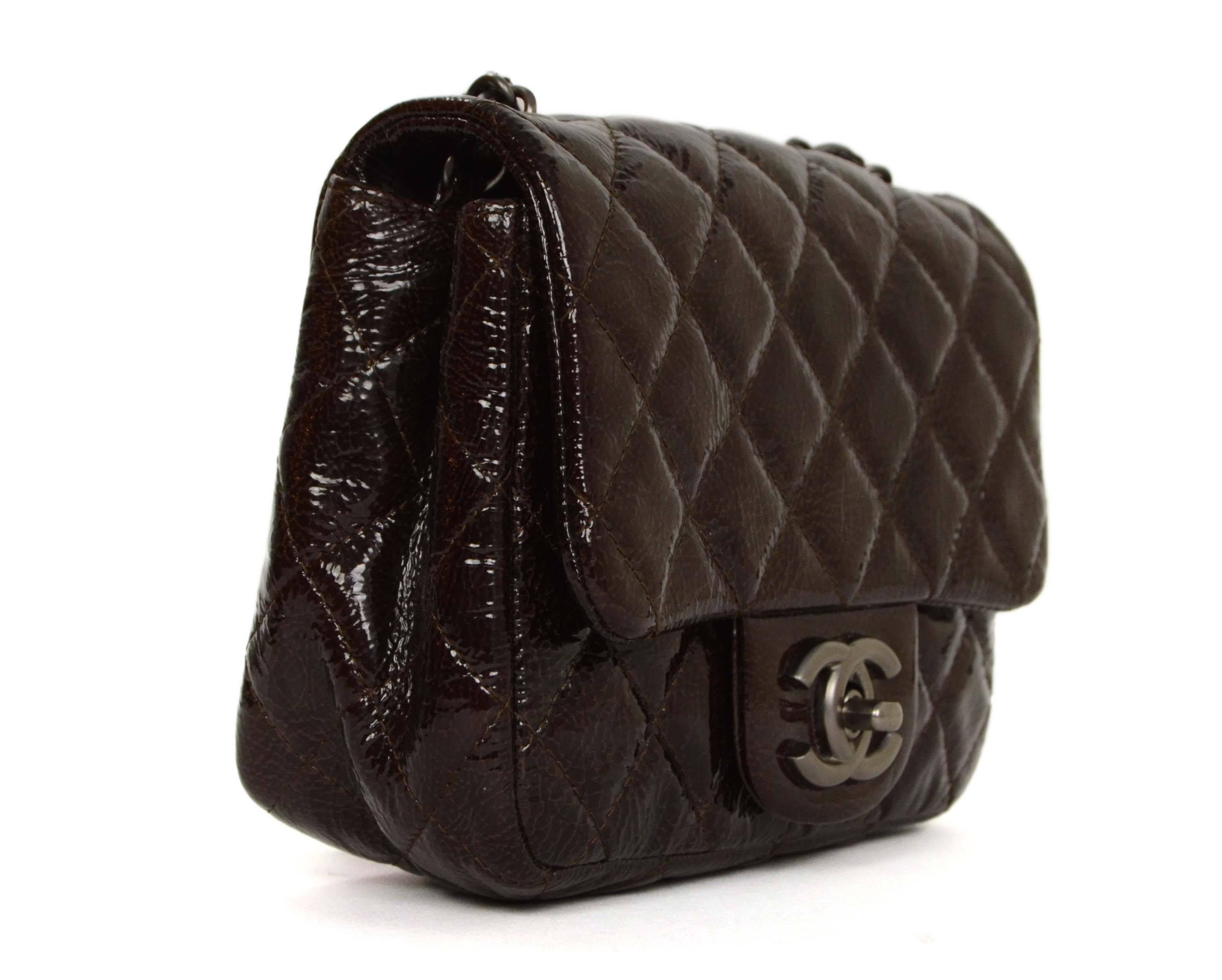 Chanel Brown Distressed Patent Leather Square Mini Flap Bag SHW

    Made In: France

    Year of Production: 2009

    Color: Brown

    Hardware: Silver

    Materials: Distressed patent leather, metal

    Lining: Brown lambskin