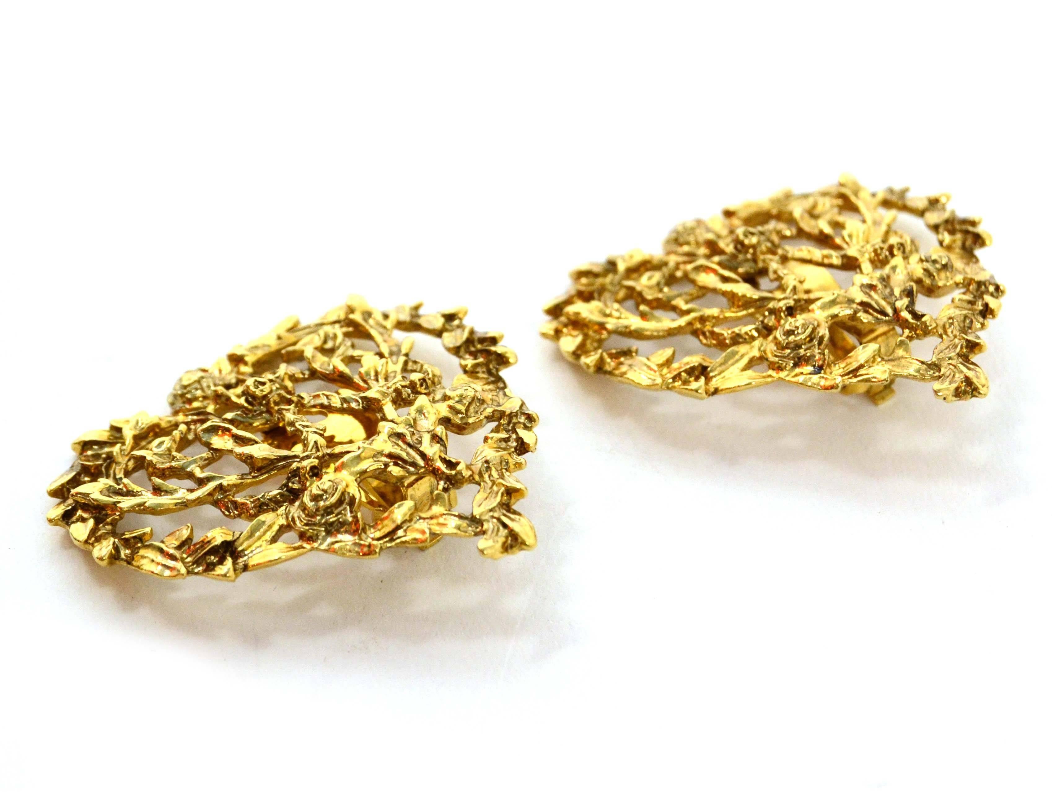 Yves Saint Laurent YSL Gold Heart Clip On Earrings
Features roses intricately designed throughout
Color: Goldtone
Materials: Metal
Closure: Clip no
Stamp: YSL
Overall Condition: Excellent pre-owned condition
Measurements: 
Length: 2