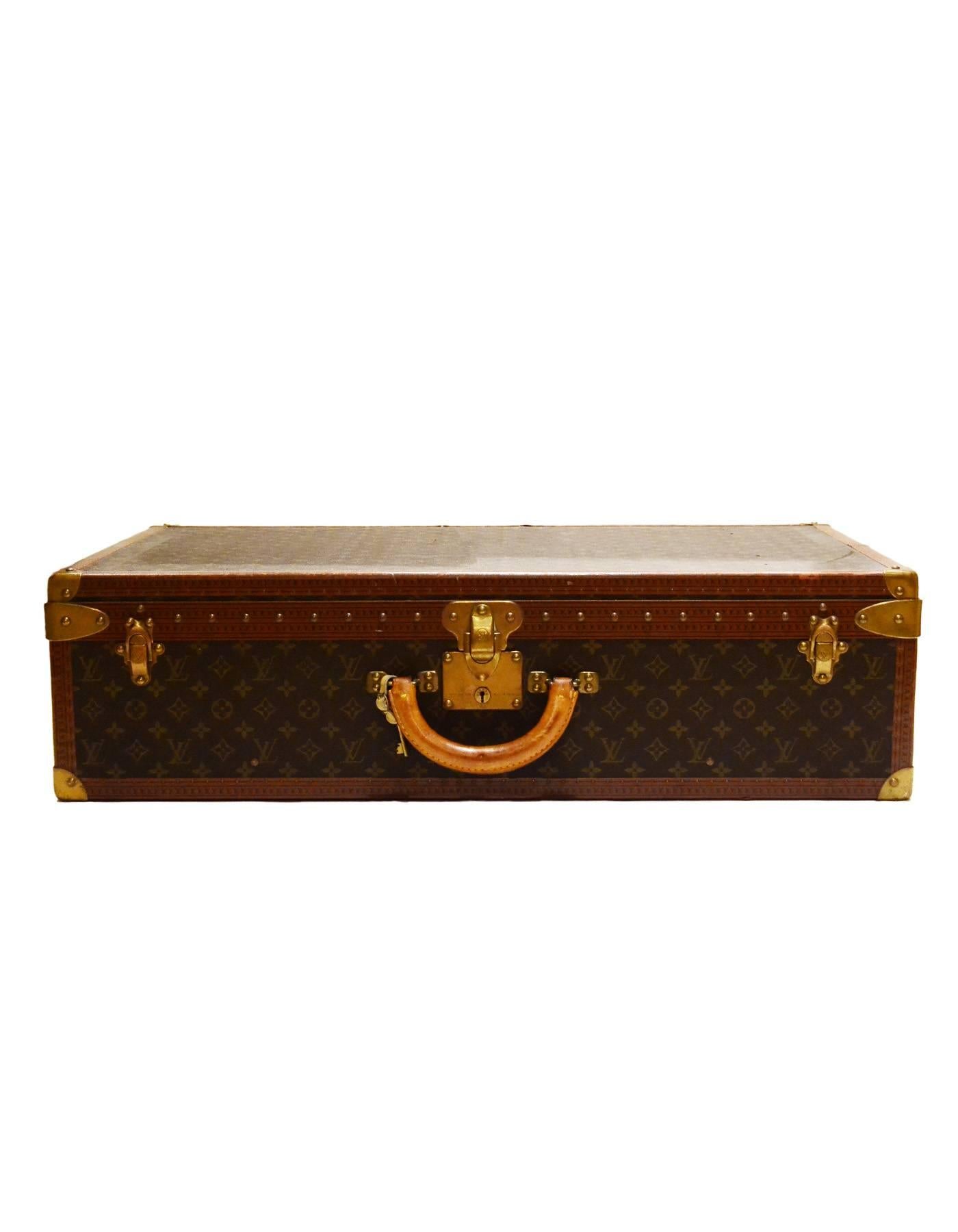 Louis Vuitton Vintage Monogram Hard Suitcase
Features removable insert/tray

Made In: France
Color: Brown and tan
Hardware: Brass
Materials: Metal, leather and coated canvas
Lining: Nude leather
Closure/Opening: Triple trunk latch closure with key