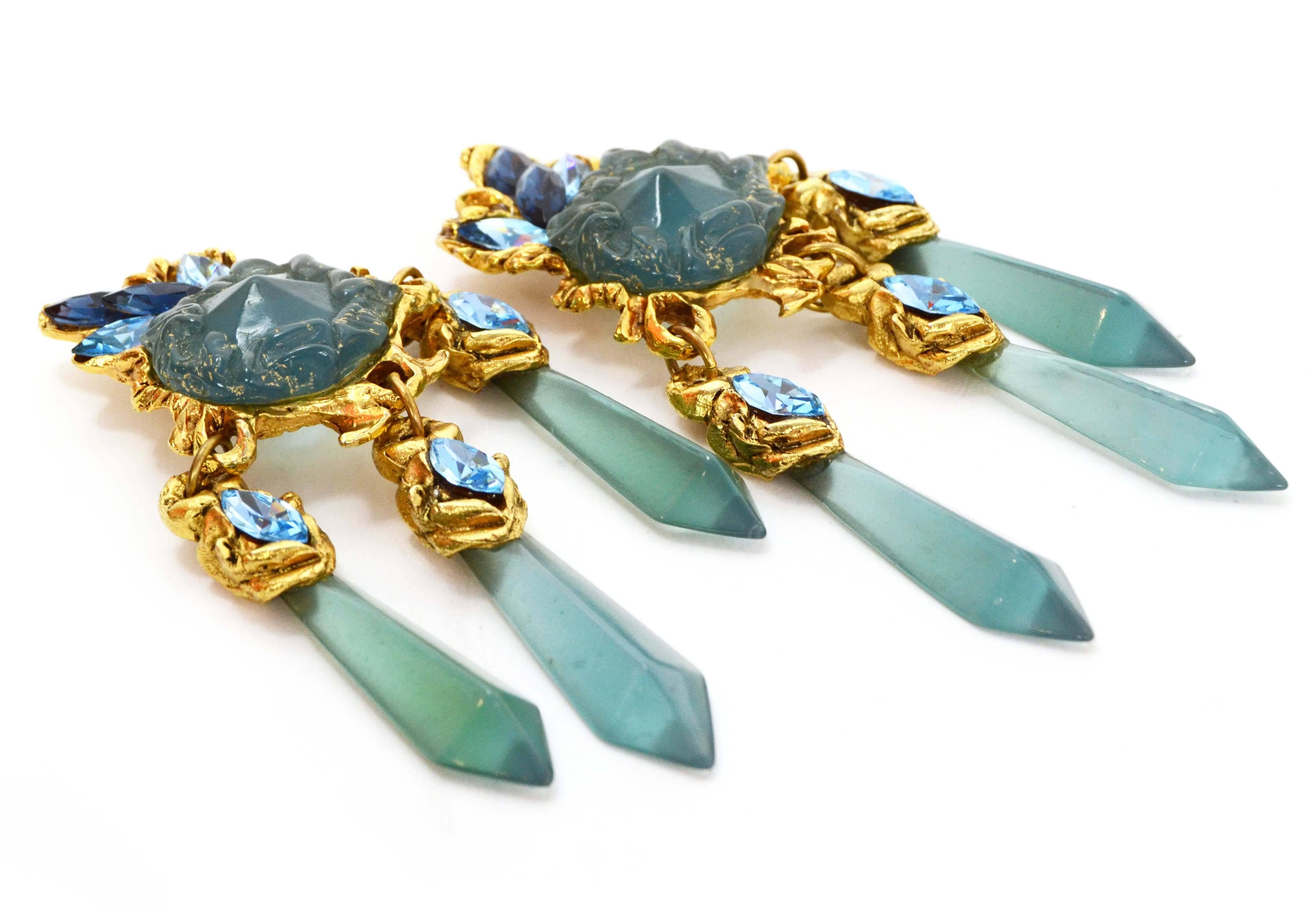 Blue Stone & Crystal Chandelier Clip On Earrings 
Features multiple shades of blue crystals and stones
Color: Blue and goldtone
Materials: Metal and stone
Closure: Clip on
Overall Condition: Excellent pre-owned condition
Measurements: