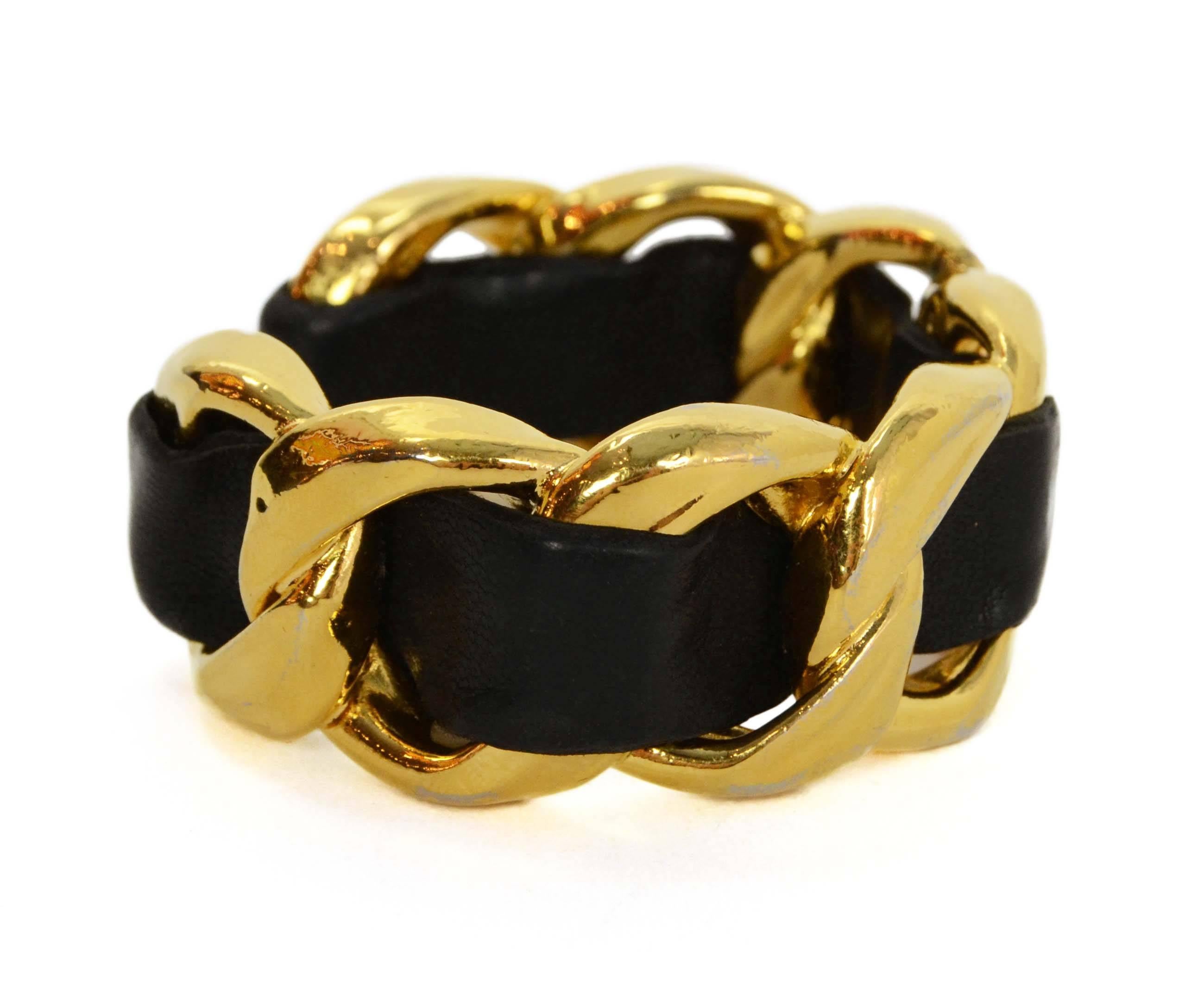 Chanel Vintage '86 Black Leather Woven Chain Link Cuff 
Made In: France
Year of Production: 1986
Color: Black and goldtone
Materials: Leather and metal
Closure: None
Stamp: 2 CC 3
Overall Condition: Excellent vintage, pre-owned