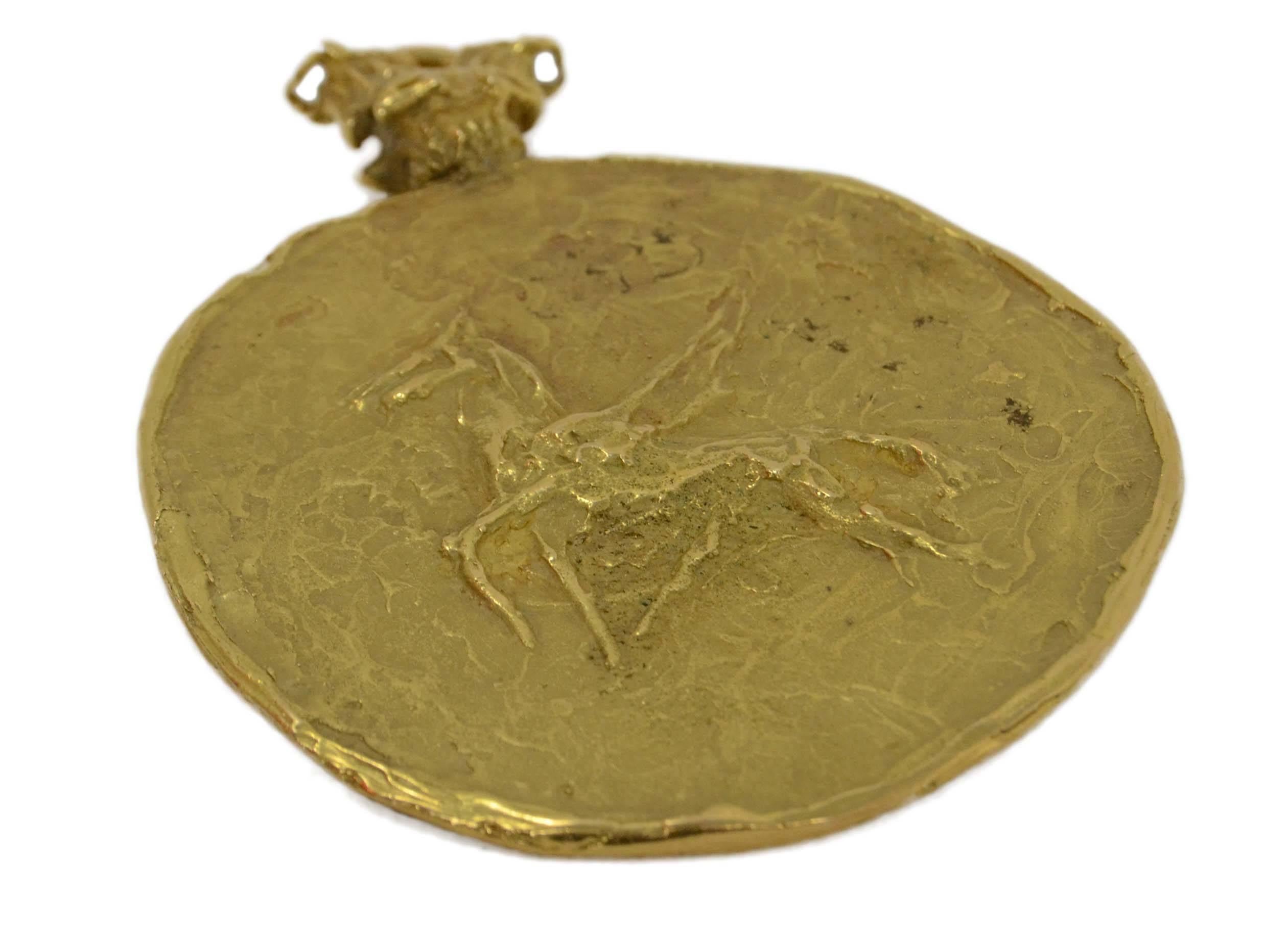 Vintage Hammered Gold Taurus Pendant 
Features Taurus designs on both sides of pendant
Color: Gold
Materials: Metal
Closure: None- has hole at top for hanging on necklace
Overall Condition: Excellent vintage, pre-owned condition
Measurements: