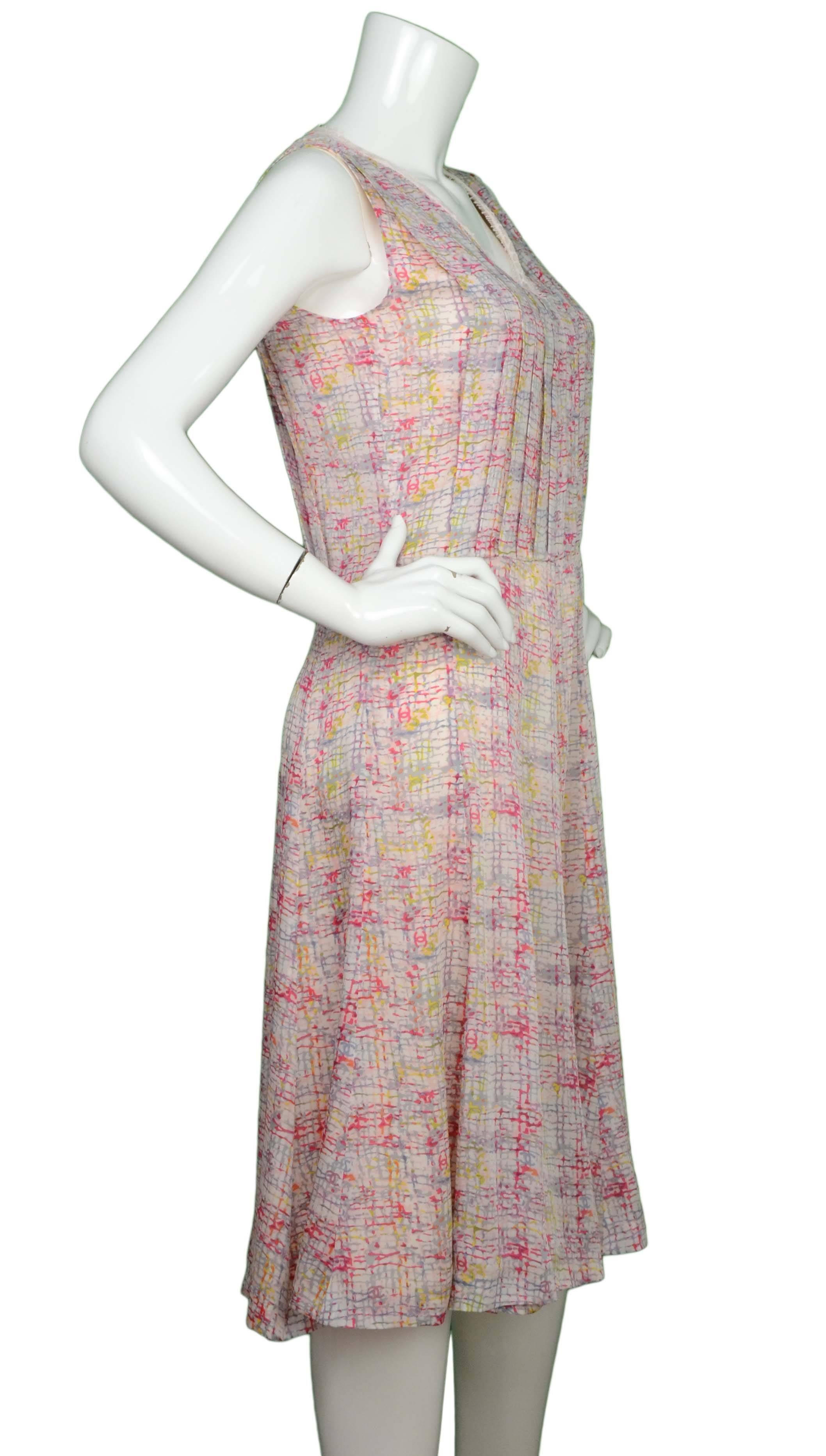 Chanel Multi-Color Silk Sleeveless Dress 
Features pink lace trim at neckline
Made In: France
Year of Production: 2005
Color: Pink, red, grey, blue, orange and yellow
Composition: 100% silk
Lining: Pink, 100% silk
Closure/Opening: Back center