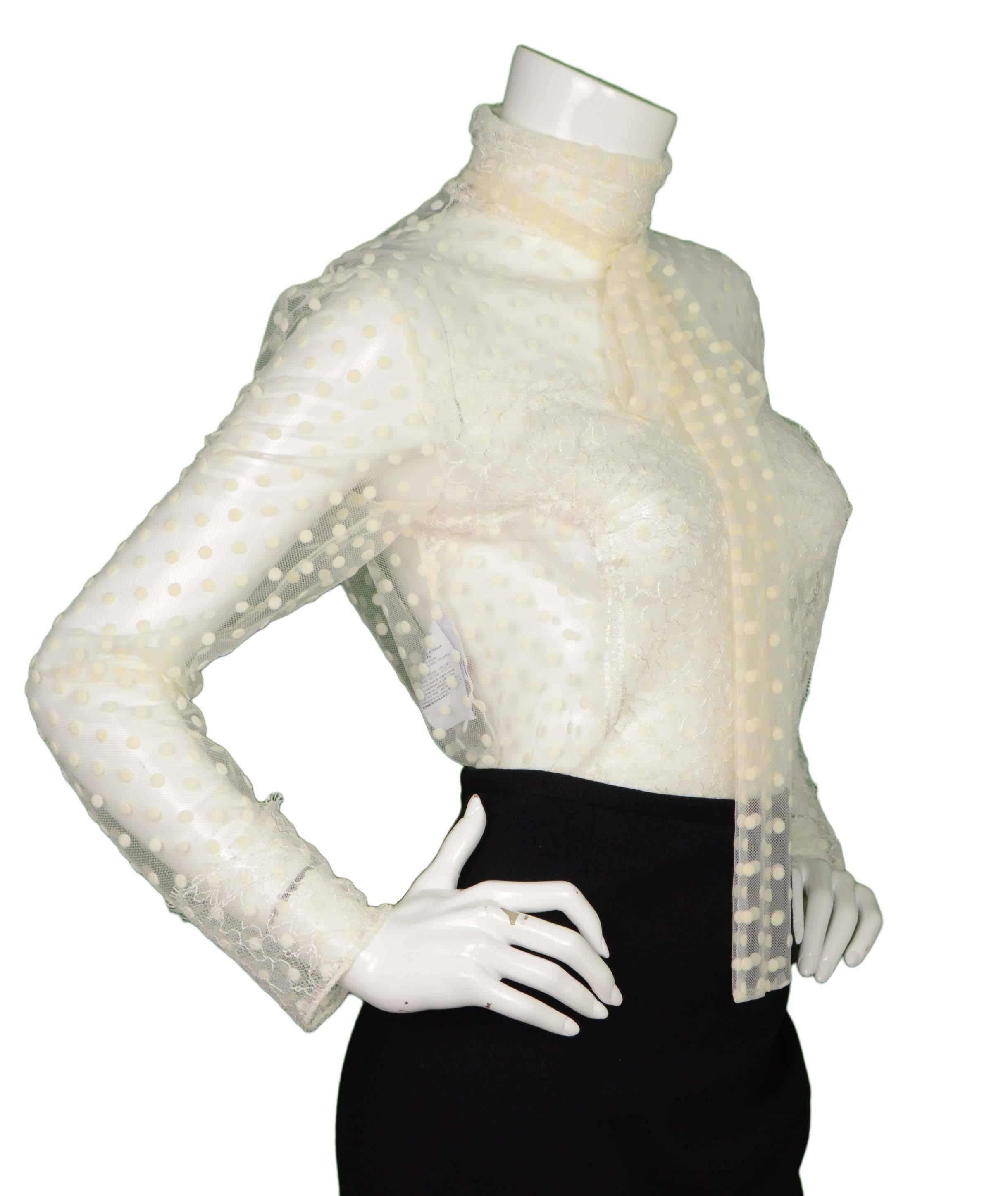 Rochas White Swiss Dot Lace Long Sleeve Blouse
Features neck tie
Made In: Italy
Color: Ivory
Composition: 66% polyamide, 34% viscose
Lining: None
Closure/Opening: Back zipper
Exterior Pockets: None
Interior Pockets: None
Retail Price: